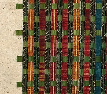 Detail of woven handmade paper. Red, green and yellow.