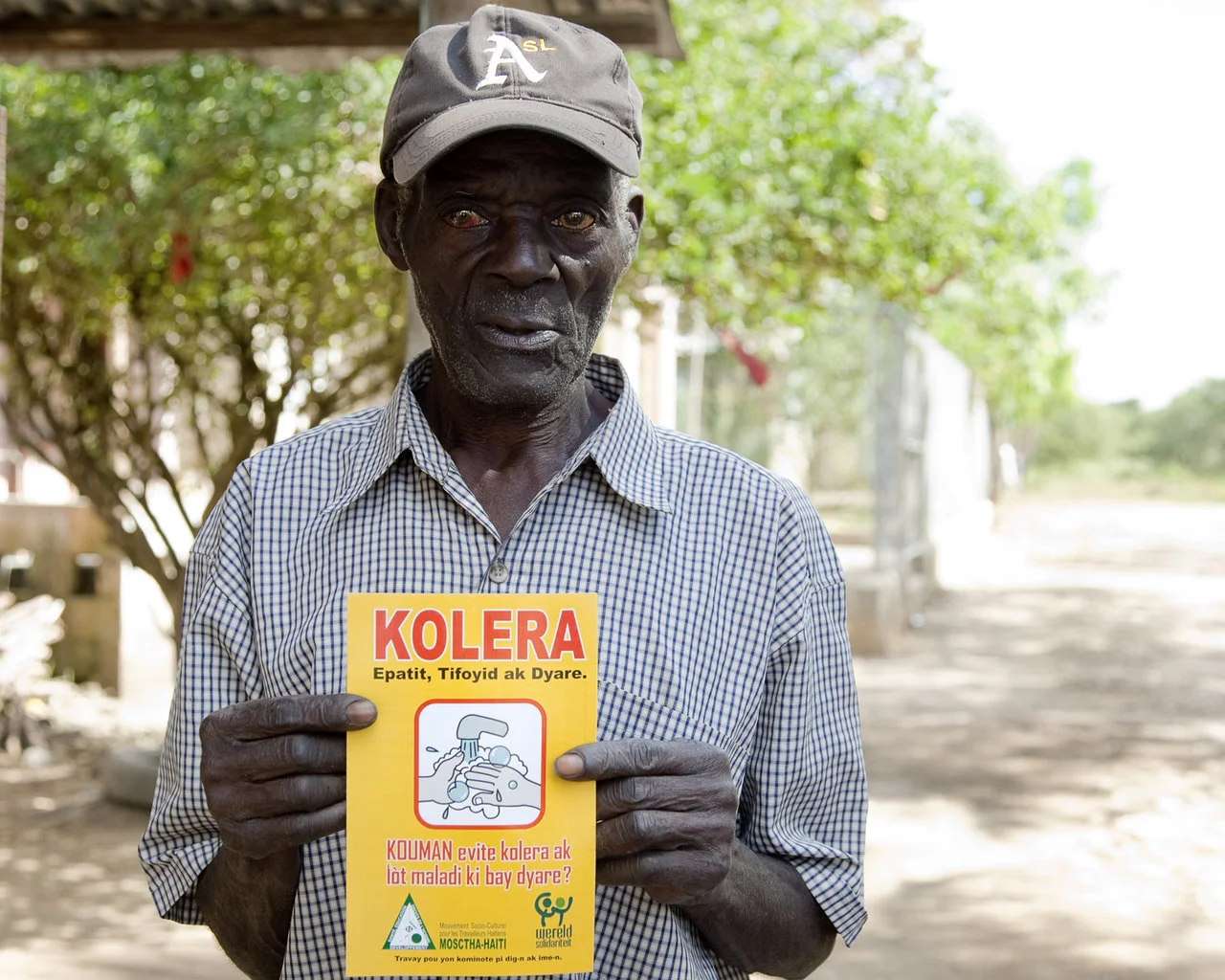 Man discussing the Cholera outbreak in Haiti