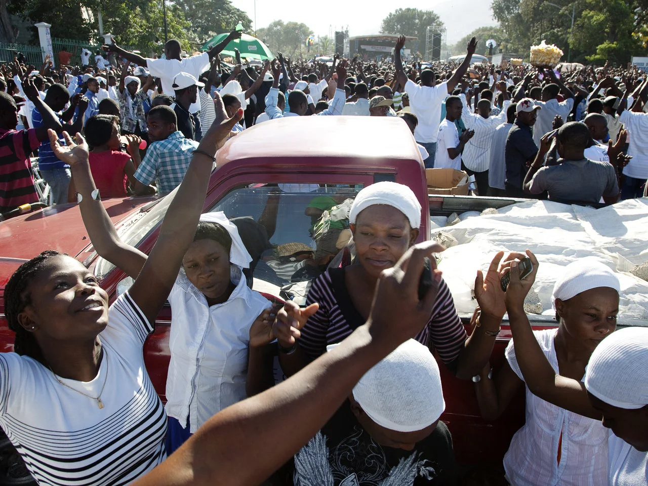 Women celebrate life at the palace, one year after the earthquake in Haiti