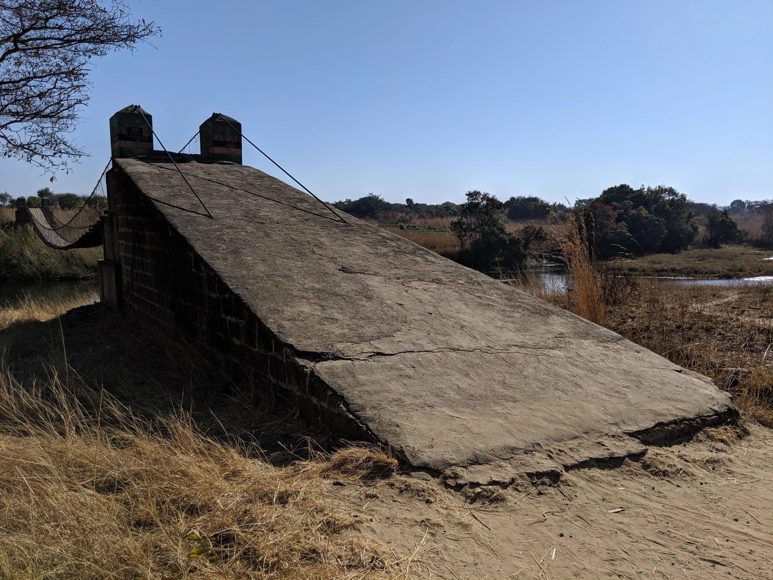 Passing the pig farm to the NE - bridge designed and built by Bridges to Prosperity. Day by De co-founder Candice De was involved in this project.