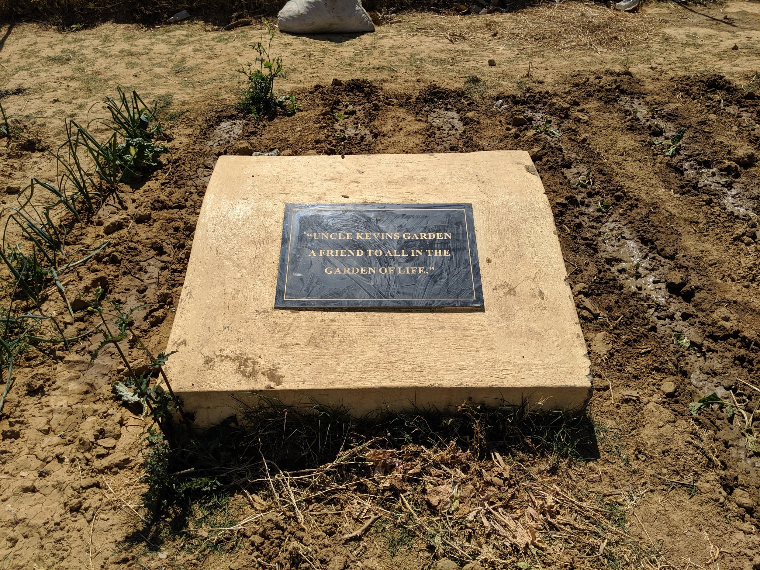 Plaque in the garden gifted to Day by De