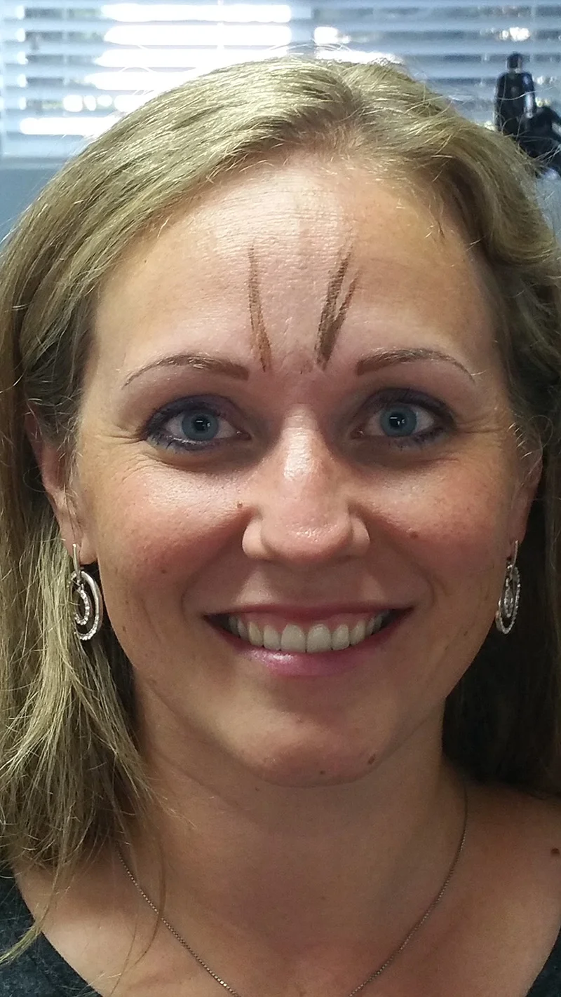 At the brow touchup, she'd like them a shade darker. We did some color smears for her to pick a new color.