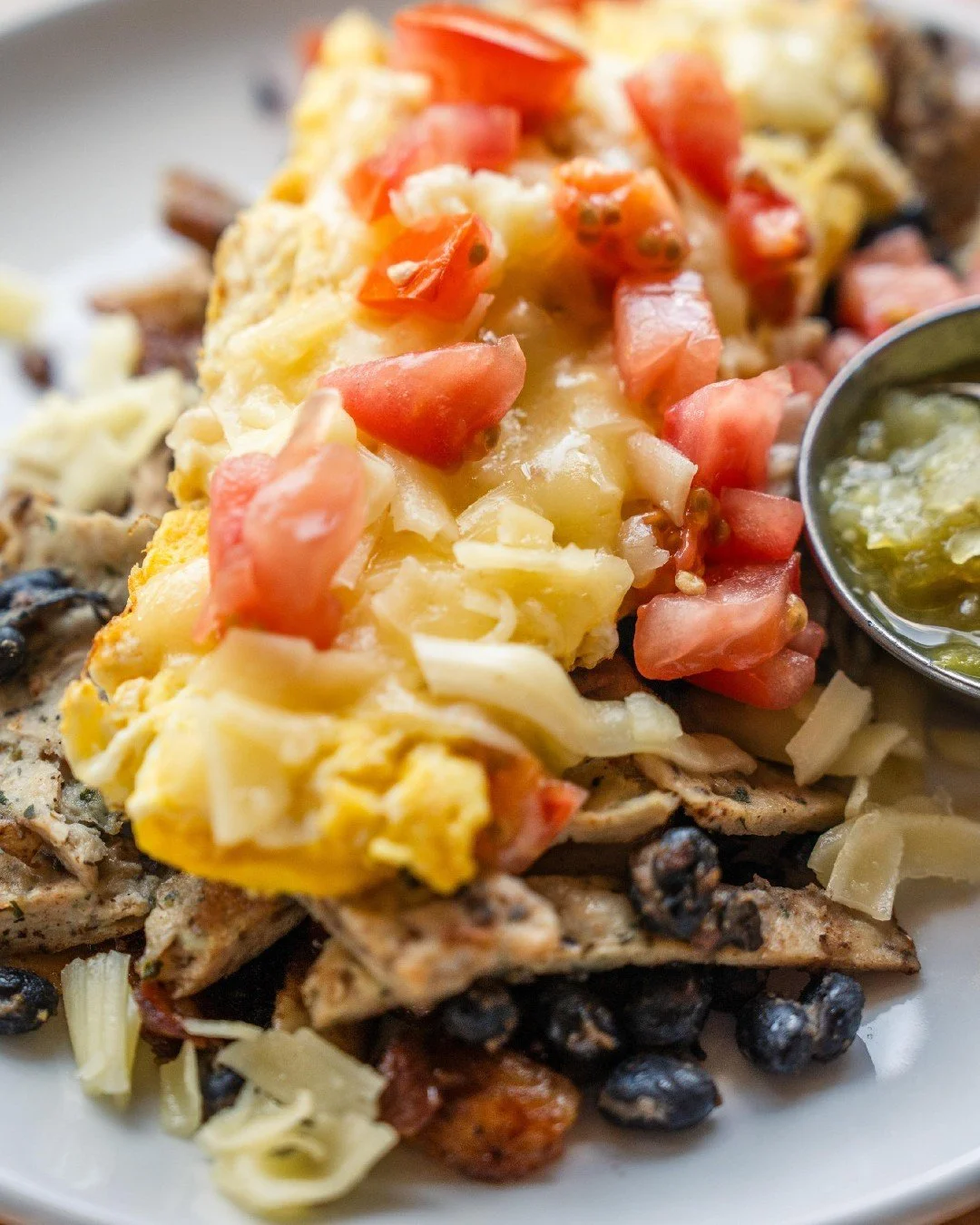 A hearty plate of local farm eggs, crispy rooster potatoes, and bold, fresh flavors in our Chicken Sausage Scramble. 🍳🍅

Have you tried it yet?! 👇