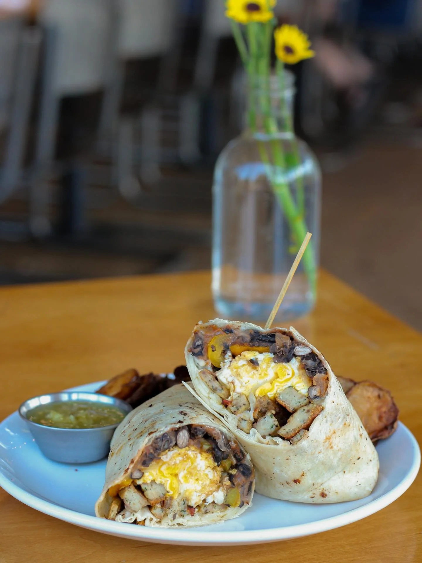 This is a breakfast game-changer! 
Local eggs, black beans, cheddar, peppers, salsa verde, choice of breakfast sausage - our breakfast burrito is a fan favorite for a reason! Bonus&hellip;smoother it with our hatch green chili sauce!😋