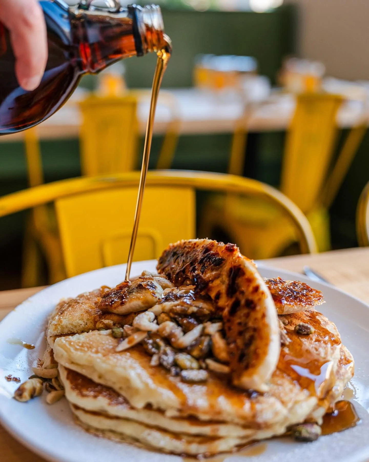 Golden Sunday mornings start here!✨
Our 🍌banana nut pancakes are stacked high with a brul&egrave;ed banana, caramel, sprinkled with toasted nuts. Let&rsquo;s brunch!!