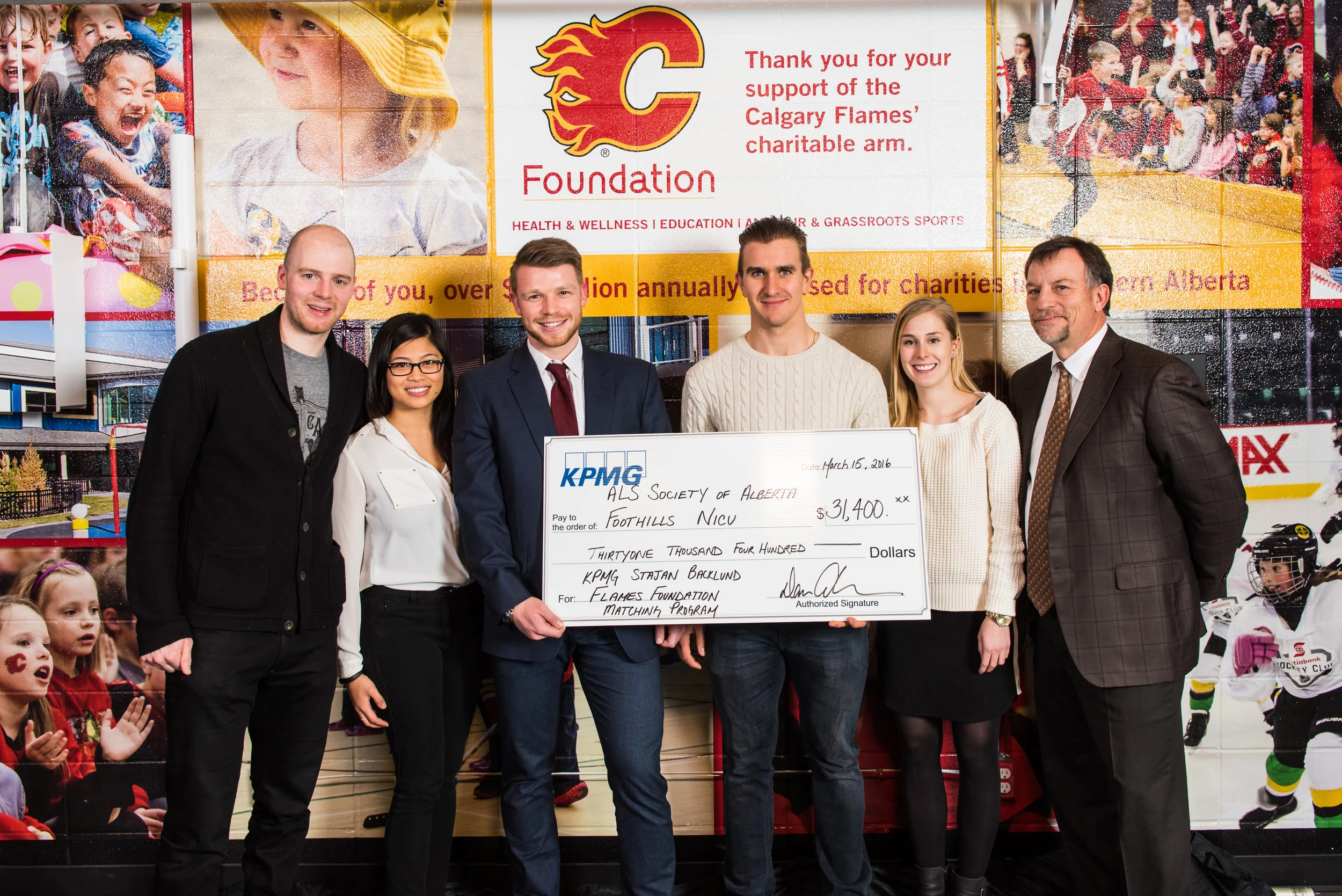 03_15_2016_Flames_KPMG_Cheque_Presentation_FInal-2.JPG