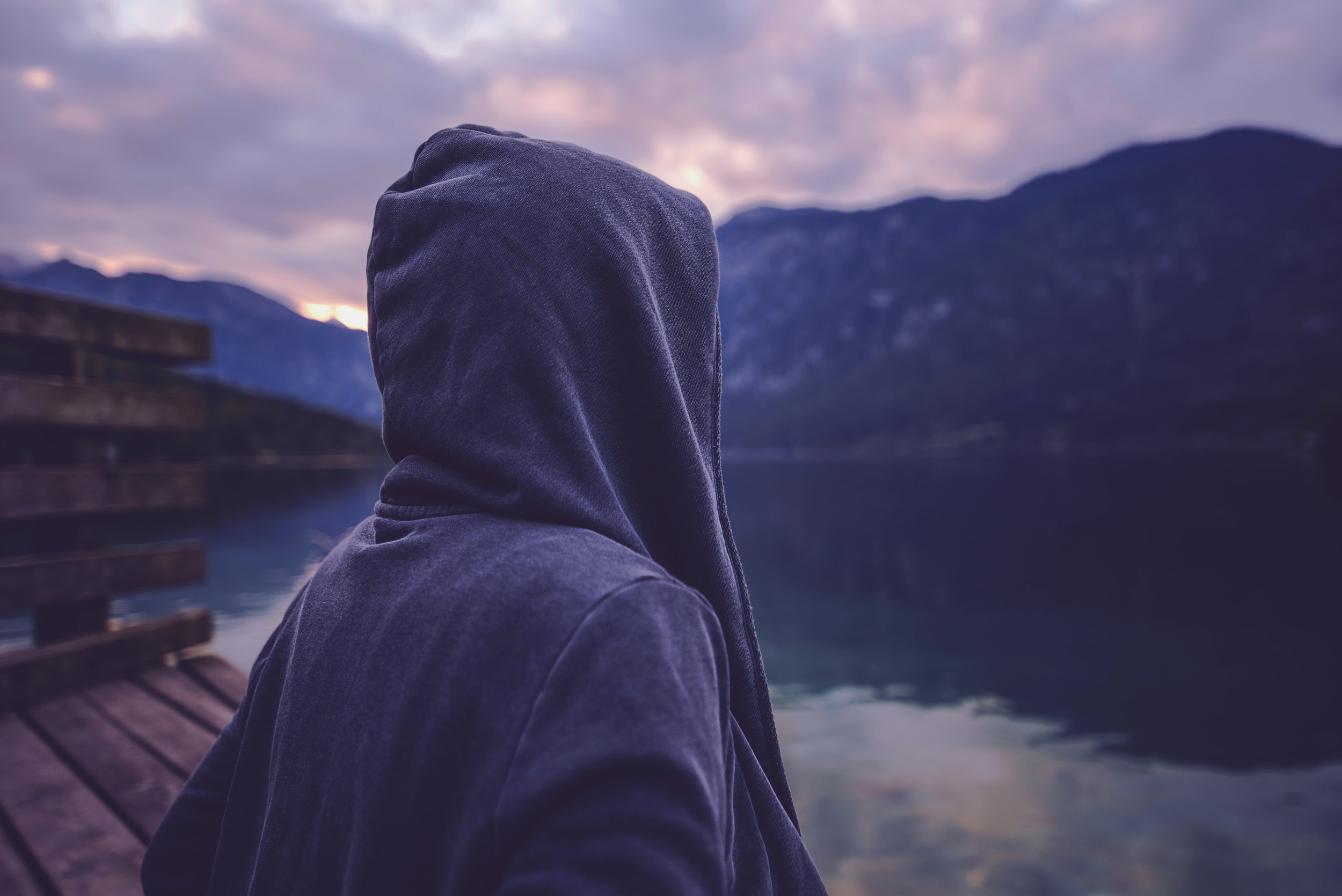 lonely-hooded-person-standing-by-the-lake-PMZWG5D.jpg