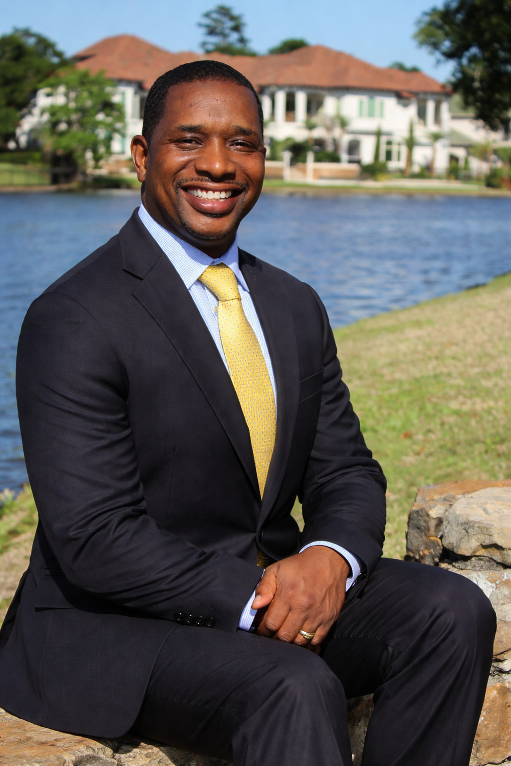 Confident man by the waterfront.png