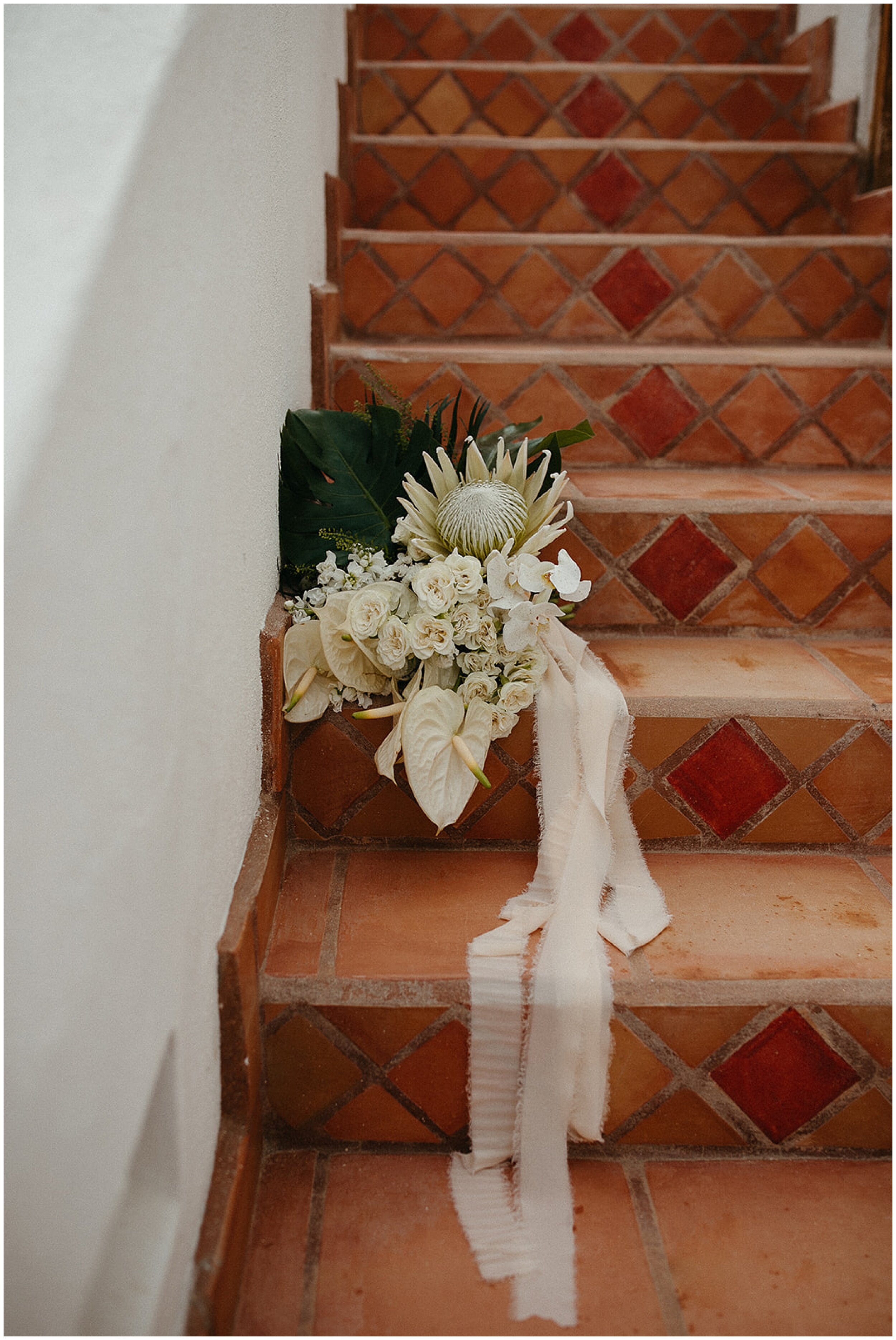 wedding bouquet sitting on stairs