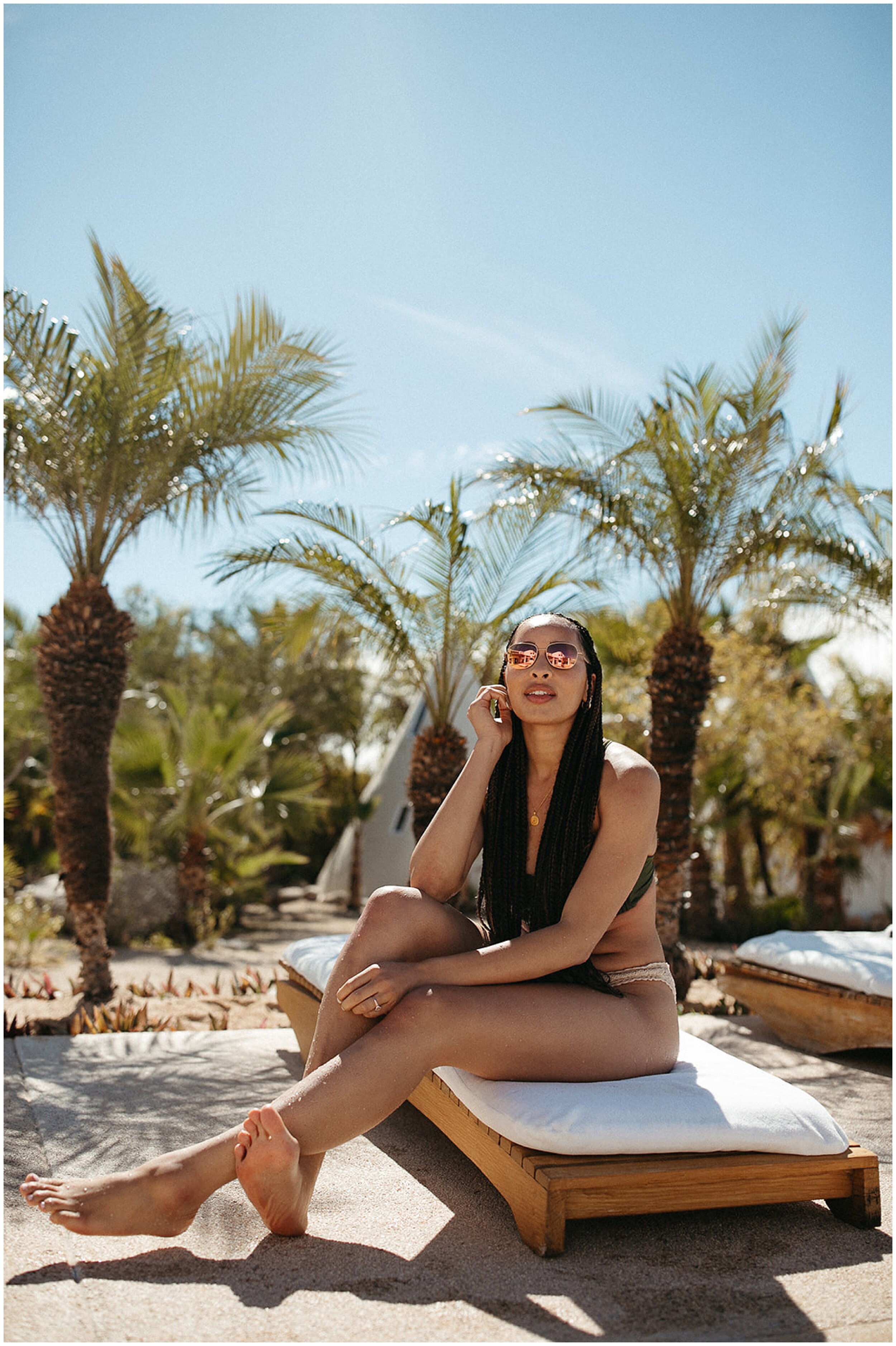 woman posing on poolchair for editorial photo