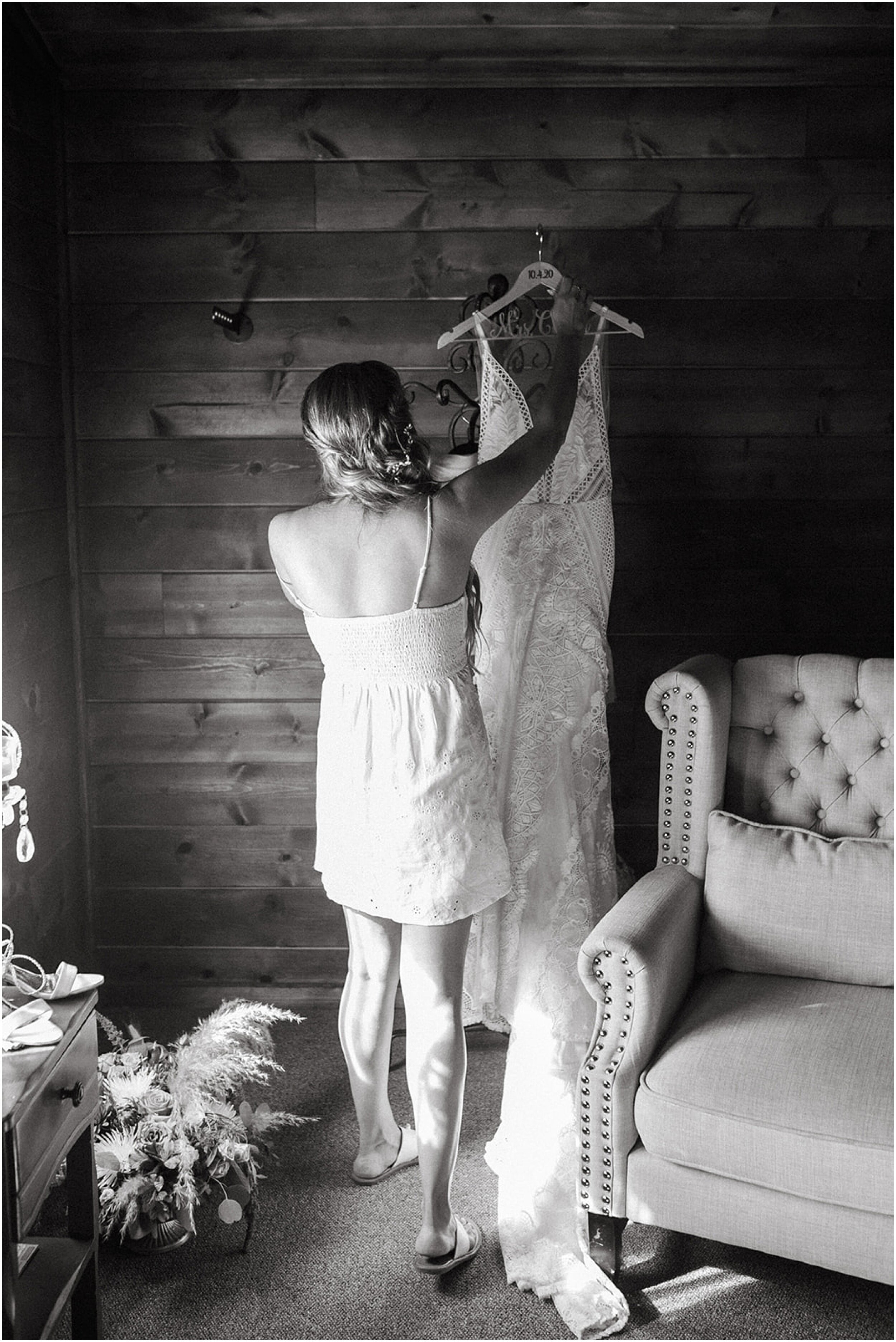 bride holding wedding dress