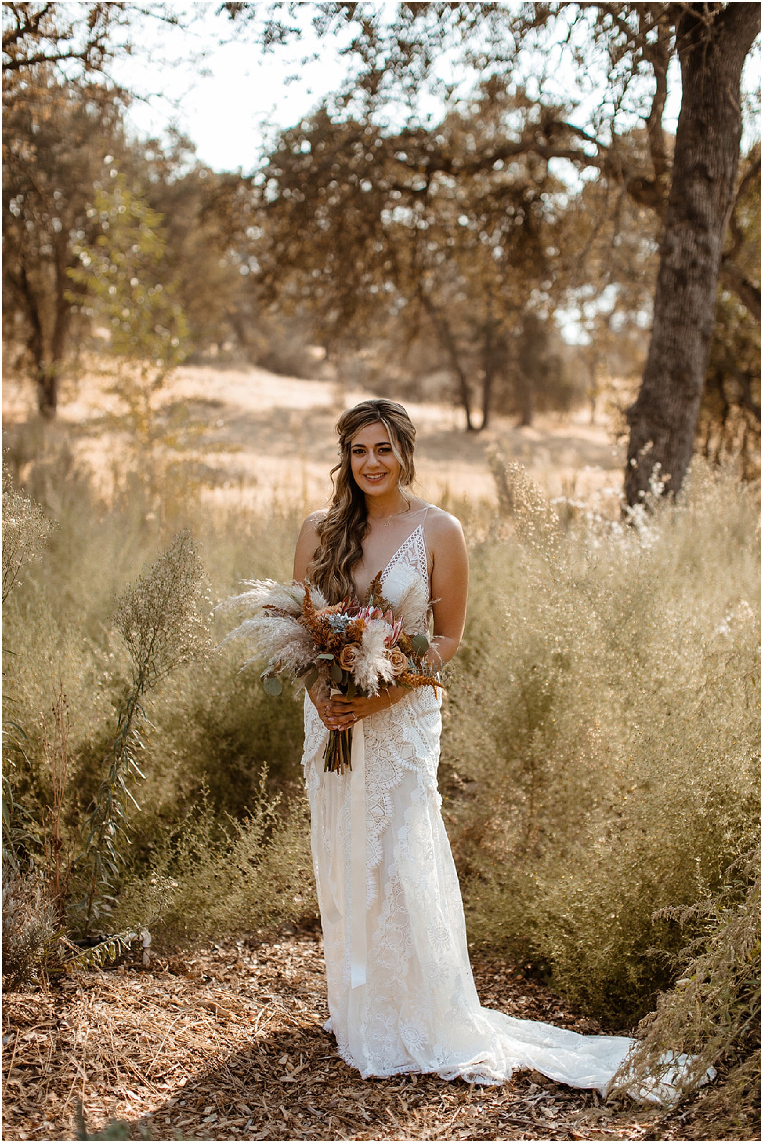 bride standing in field
