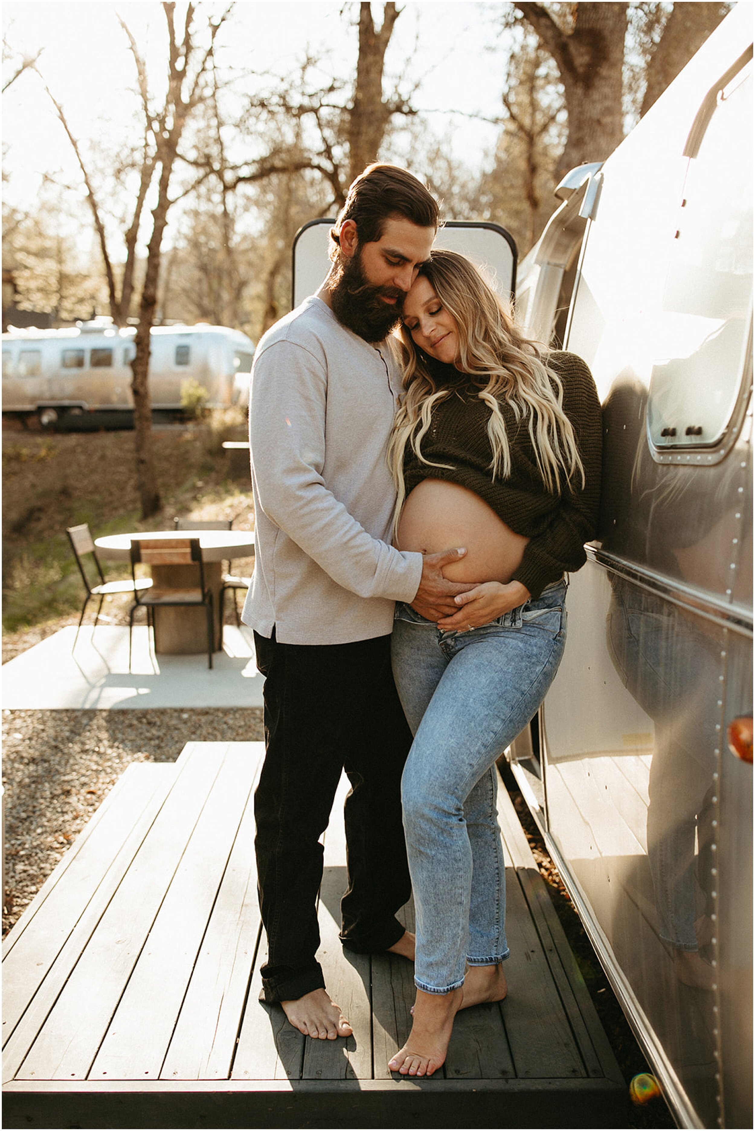 couple holding pregnant belly