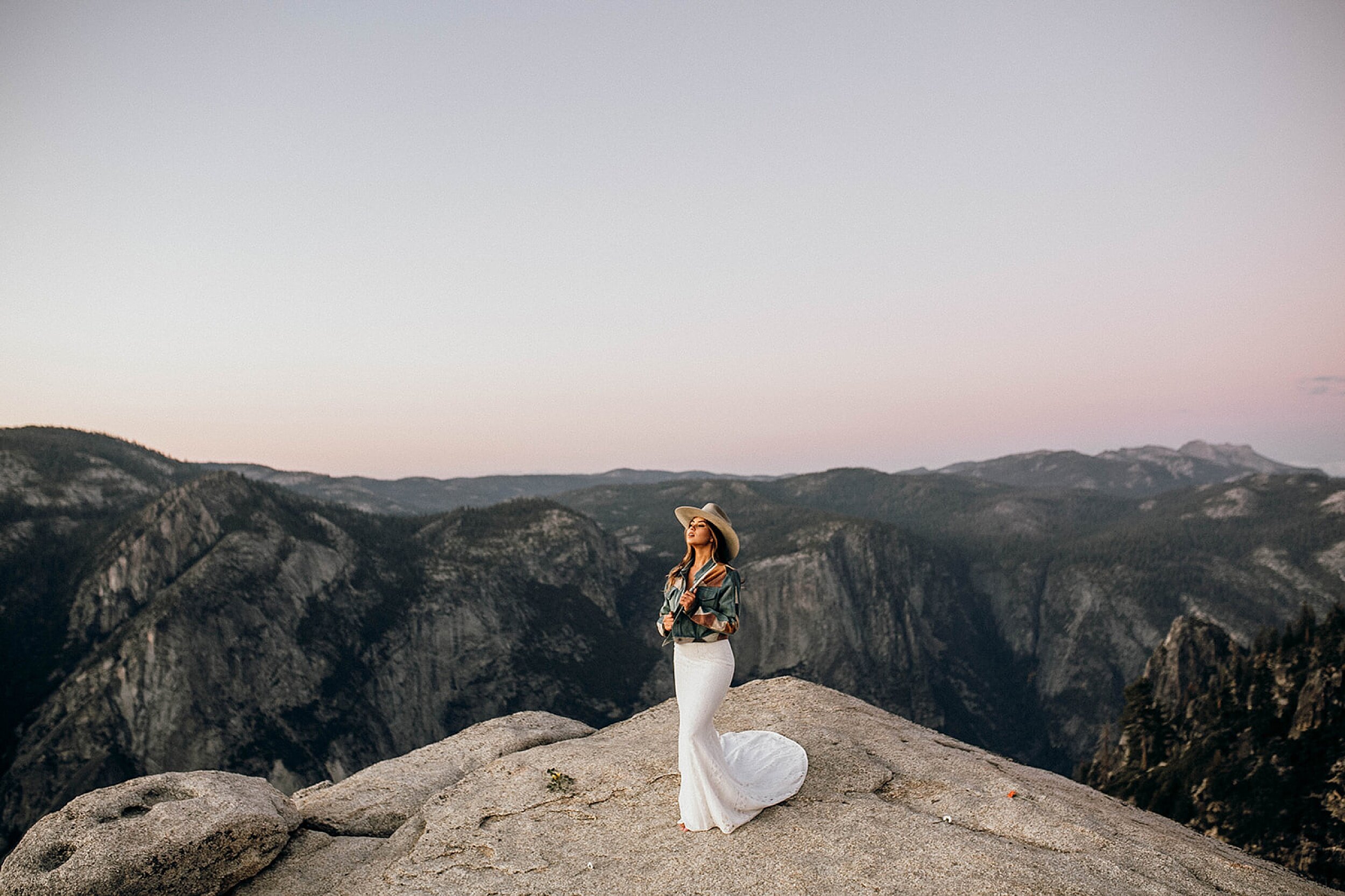 bride standing in mountains