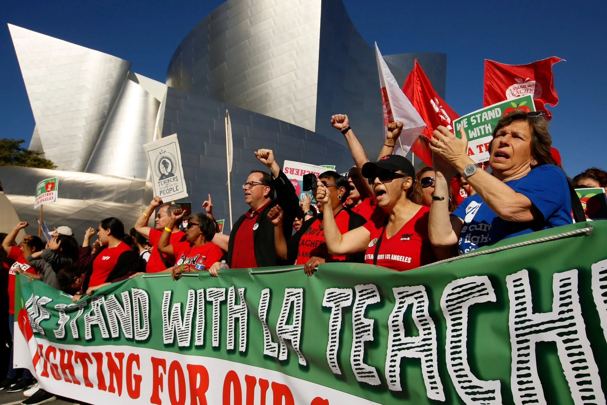 Alex Caputo-Pearl, the president of United Teachers Los Angeles, center, at a rally in December. Teachers in the Los Angeles Unified School District are expected to strike this week. Credit Damian Dovarganes/Associated Press