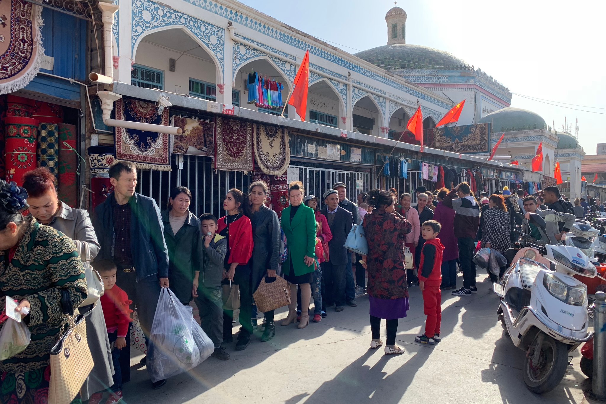 Shoppers lined up for identification checks outside the Kashgar Bazaar last fall. Members of the largely Muslim Uighur minority have been under Chinese surveillance and persecution for years. Credit Paul Mozur