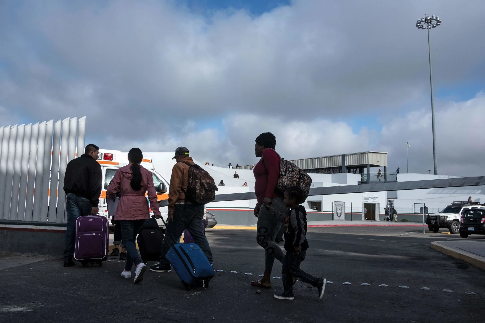 Asylum seekers last week in Tijuana, Mexico, at the El Chaparral port of entry. Credit Guillermo Arias/Agence France-Presse — Getty Images