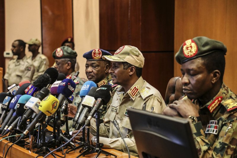 In this April 30, 2019 file photo, Gen. Mohamed Hamdan Dagalo, the deputy head of the military council, second right, speaks at a press conference in Khartoum, Sudan. As the uprising against Sudanese President Omar al-Bashir gained strength, Egypt, the United Arab Emirates and Saudi Arabia began reaching out to the military through secret channels to encourage his removal from power. (AP Photo)