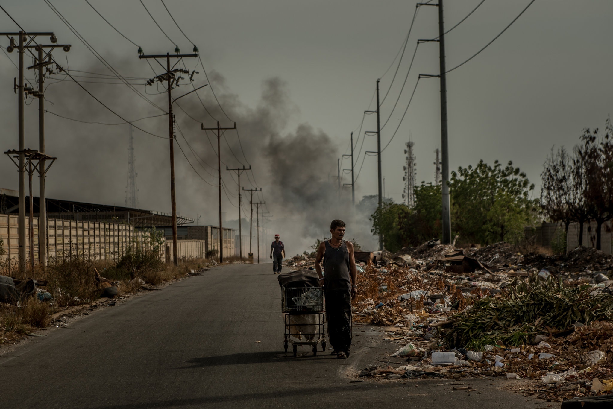In Maracaibo, men searching for refuse that can be salvaged or recycled.Credit Meridith Kohut for The New York Times