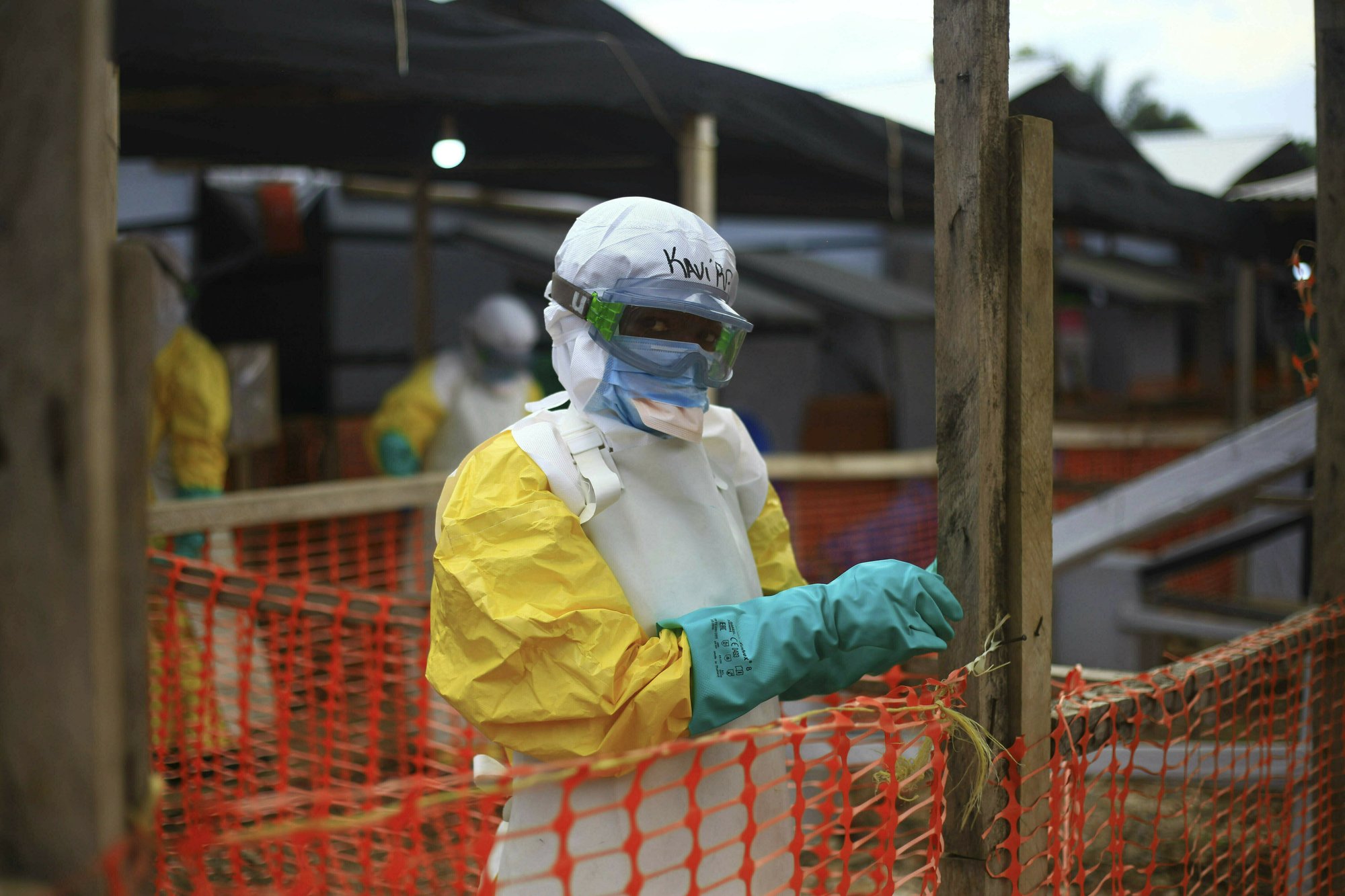 This Tuesday, April, 16, 2019 file photo taken in Congo shows an Ebola health worker at a treatment center in Beni, Eastern Congo. Uganda's health ministry said late Tuesday, June 11, 2019 that a 5-year-old Congolese boy who crossed into Uganda has tested positive for Ebola in what is the first cross-border case of the deadly virus since an outbreak started in neighboring Congo last year. (AP Photo/Al-hadji Kudra Maliro, File)
