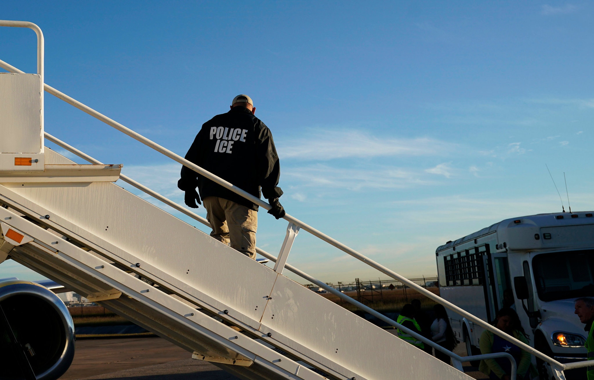 An Immigration and Customs Enforcement agent as deportations were being carried out in November in Houston. Credit David J. Phillip/Associated Press