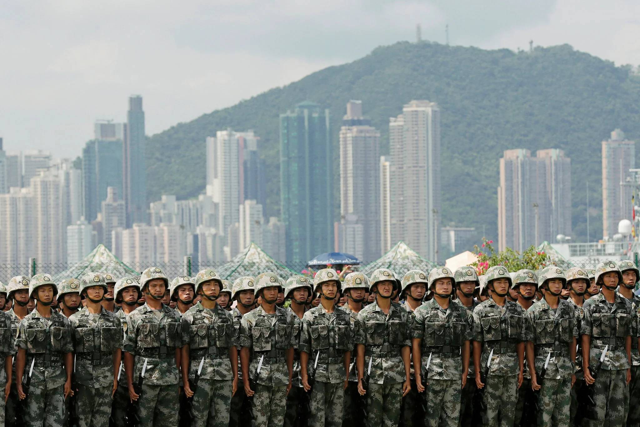 People’s Liberation Army soldiers at Stonecutters Island naval base in Hong Kong last month. China warned that it could mobilize Chinese troops to maintain order in Hong Kong. Credit Tyrone Siu/Reuters