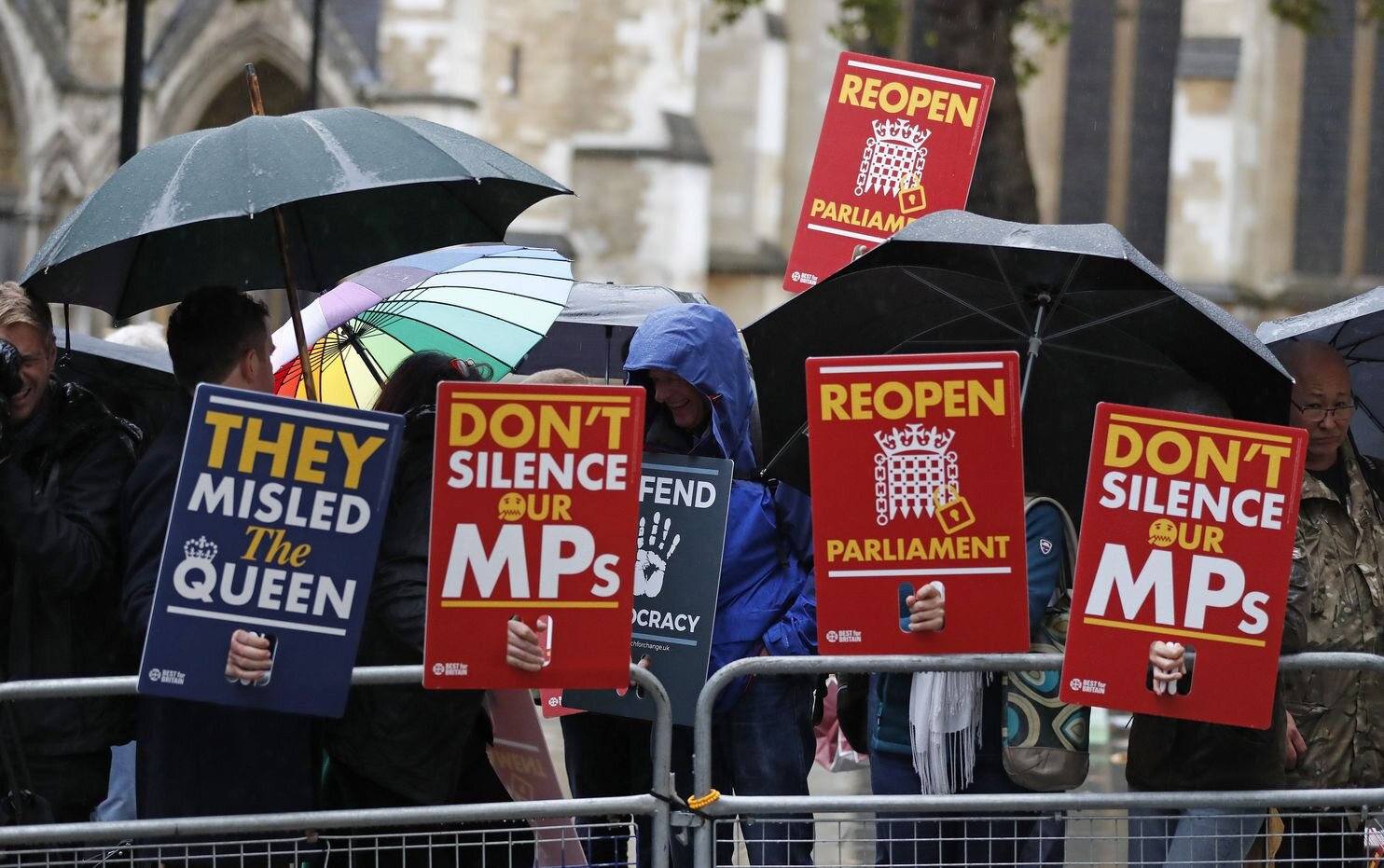 Anti-Brexit supporters gather in the rain outside the Supreme Court in London, Sept. 24, 2019. (Frank Augstein/AP)