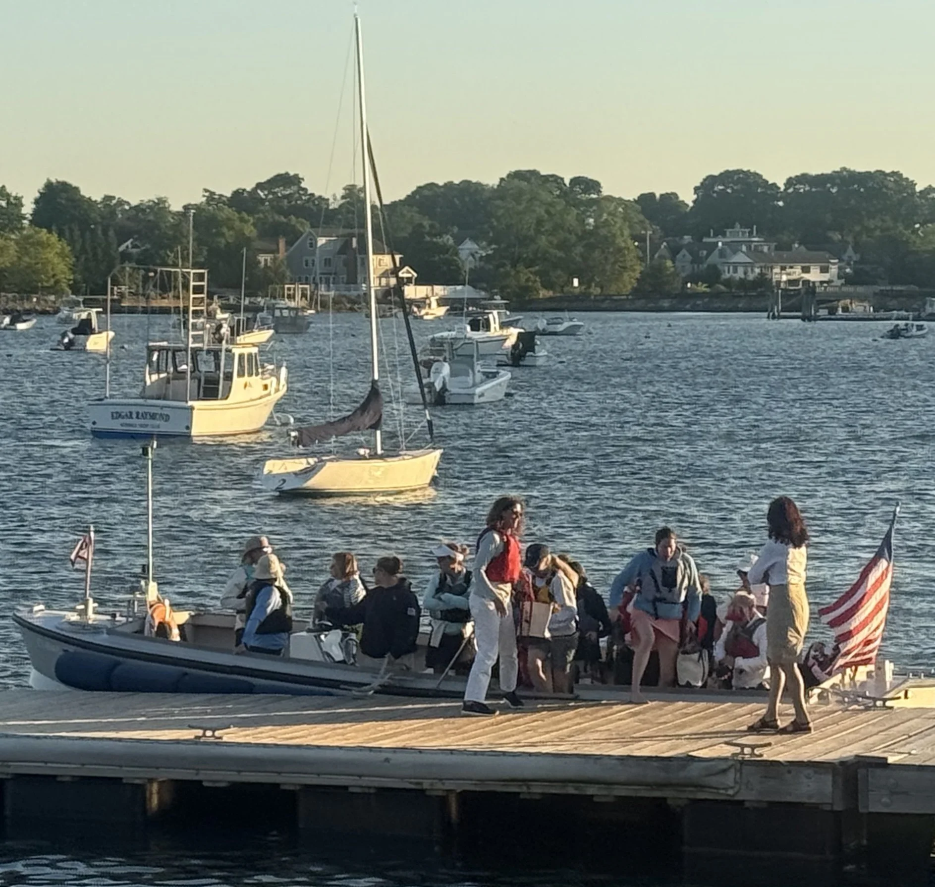 Women sailors ride the launch for the 2026 supper series at Norwalk Yacht club for Women on the Water LIS