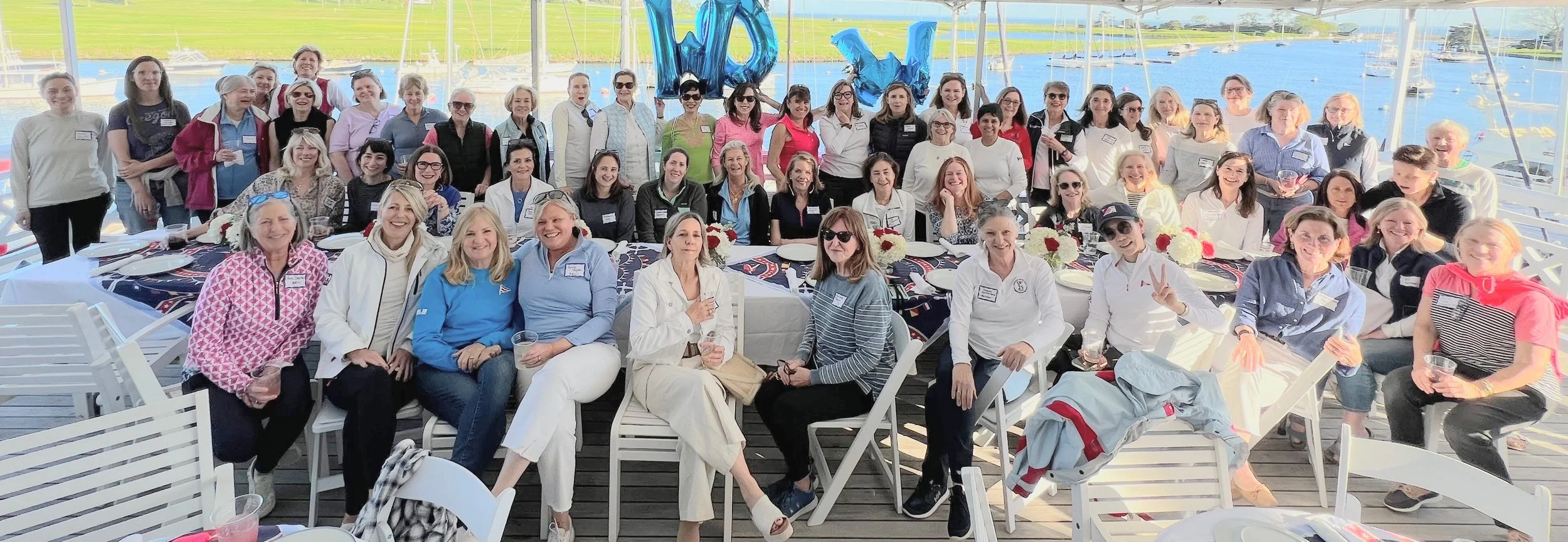 Women Sailors gather on the deck of the Pequot Yacht Club for the 2025 Women on the Water supper series
