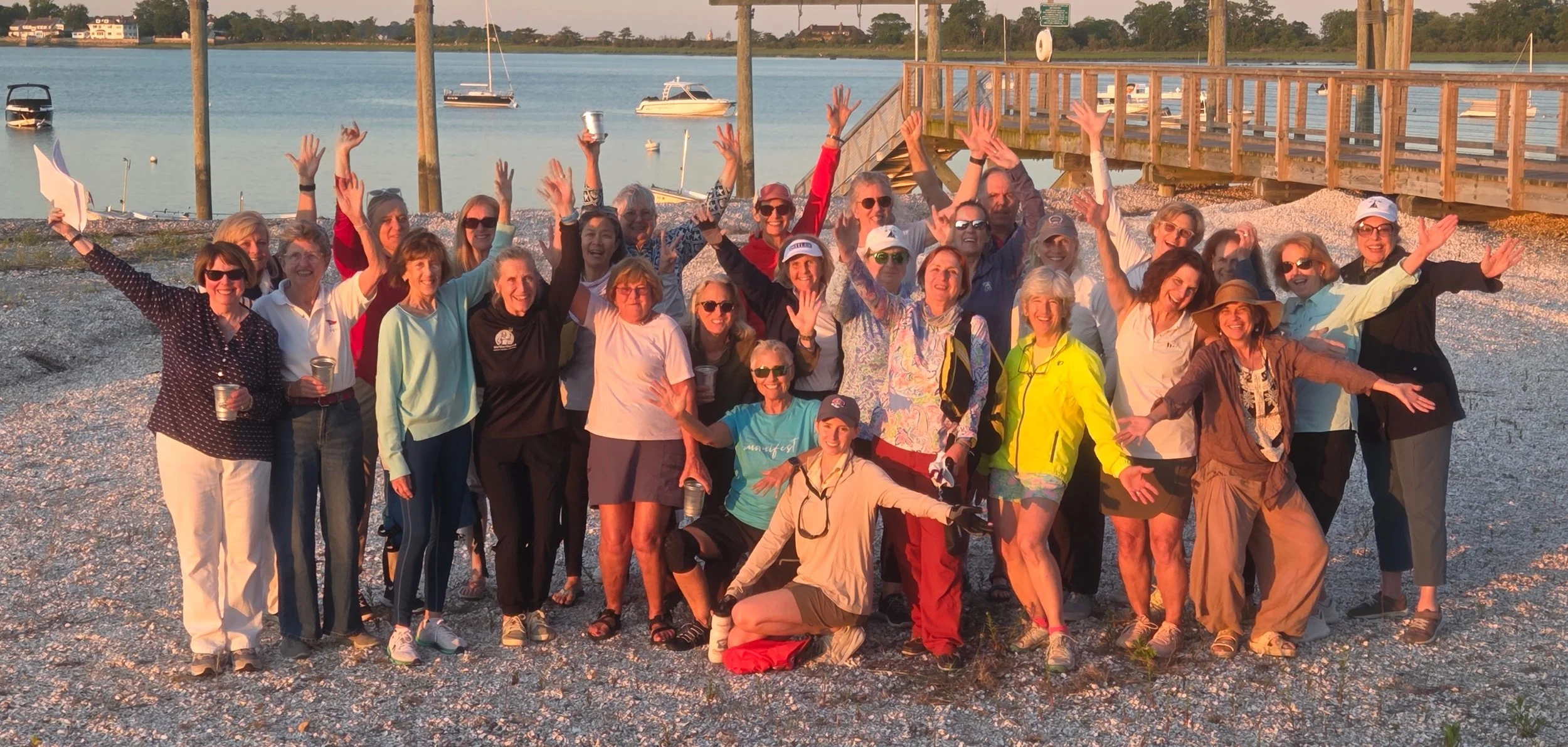 On the beach, participants of the Old Greenwich Yacht Club Women on the Water supper series for 2026