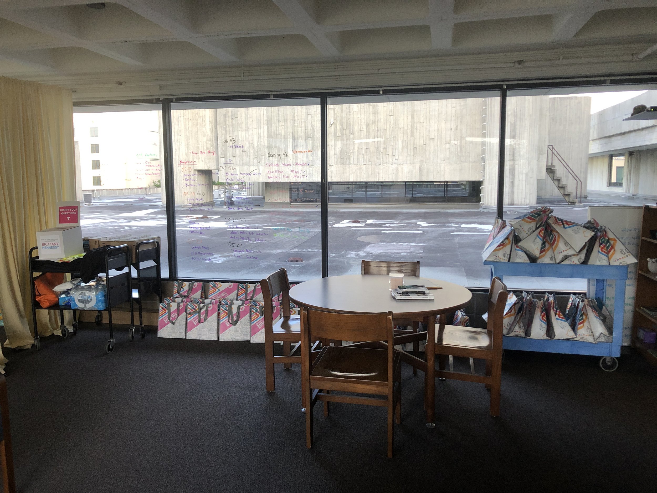 The view from my desk. Supplies and swag bags were ALL OVER.