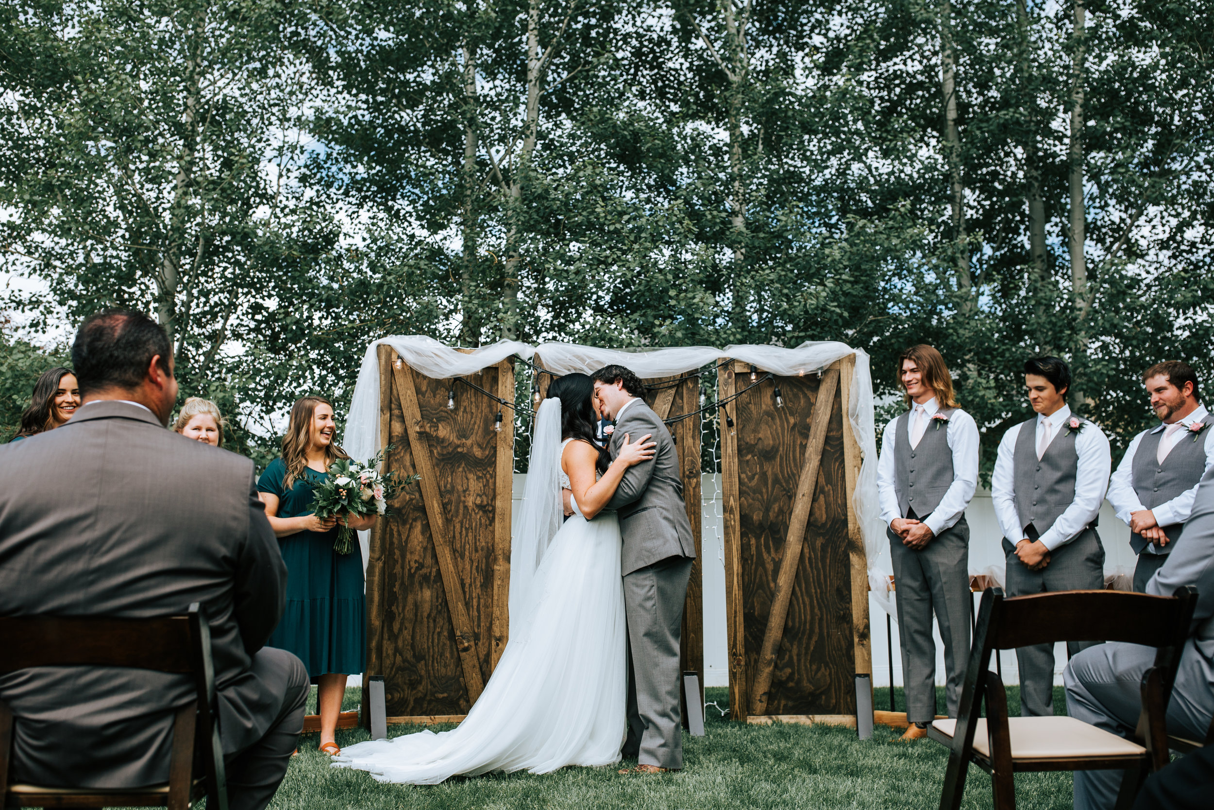 Utah backyard wedding trees wood backdrop