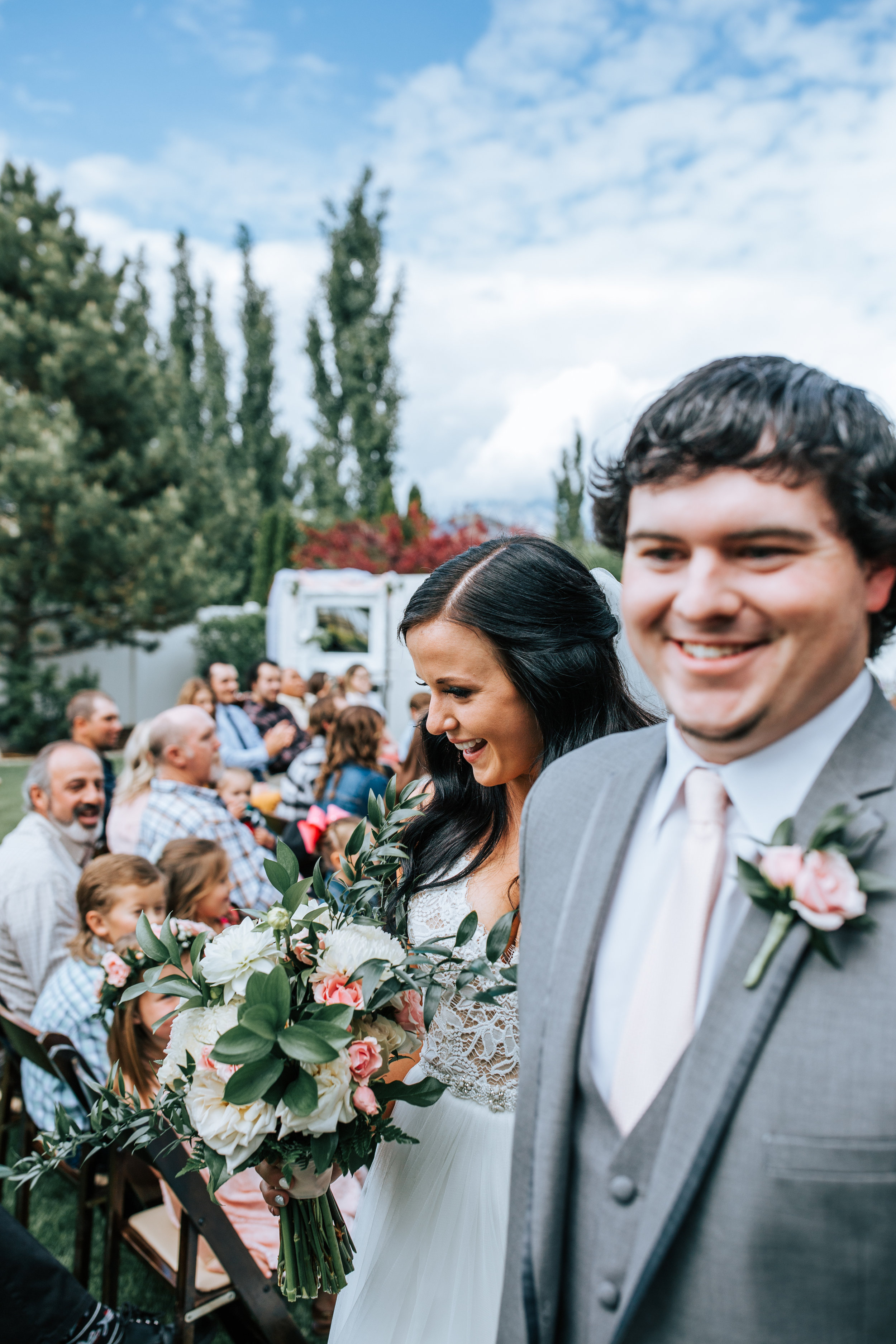 Utah backyard wedding ceremony bride and groom exit