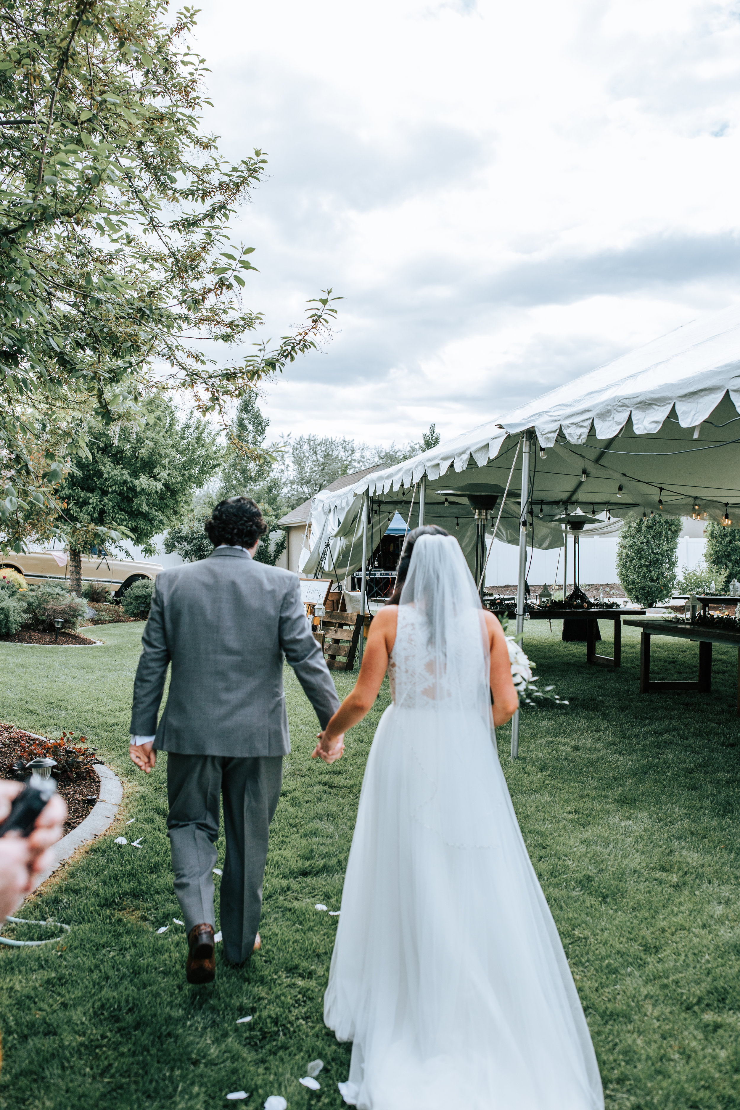 Utah bride and groom exit backyard wedding