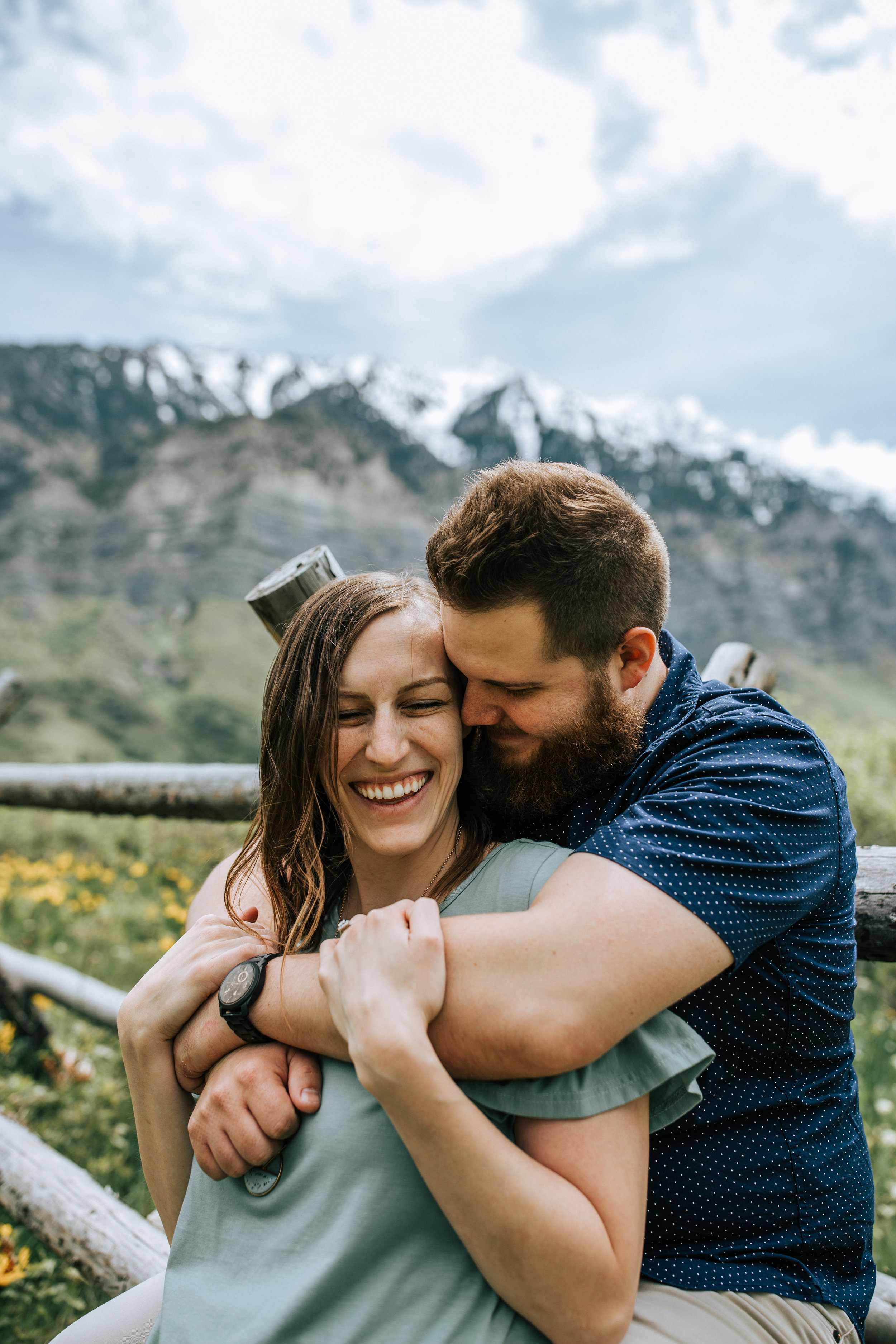 Windy mountain couples photos in Utah windflower field