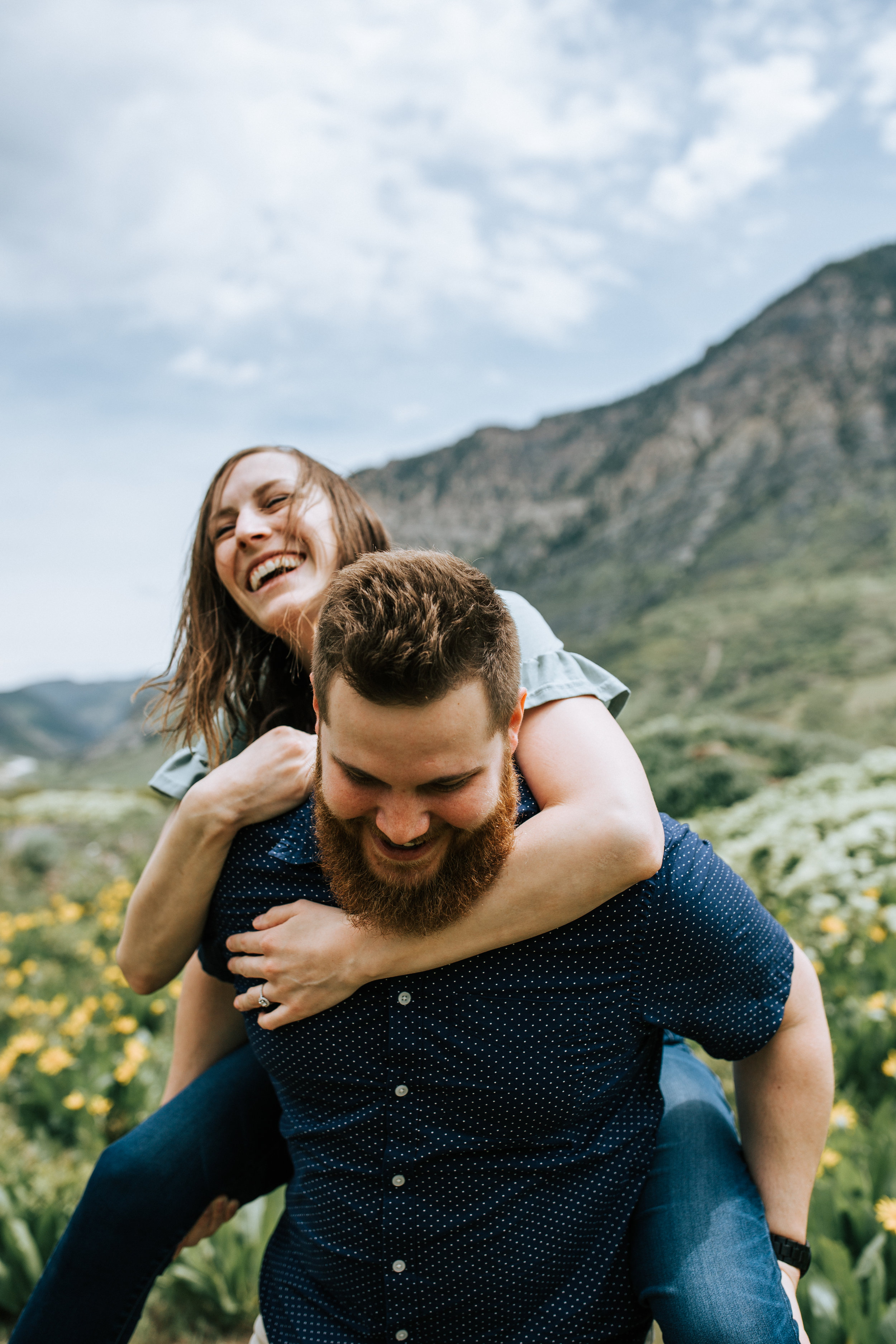 Windy mountain couples photos in Utah windflower field