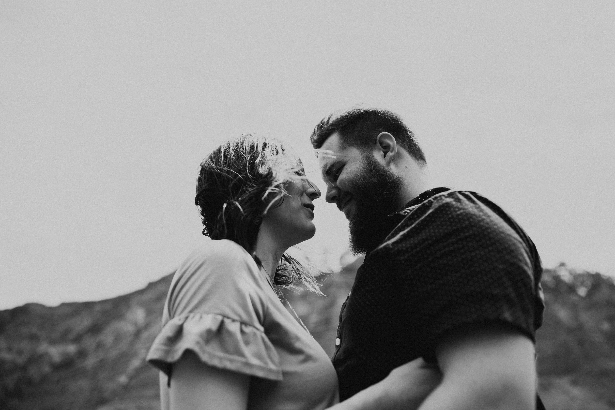 Windy mountain couples photos in Utah windflower field black and white