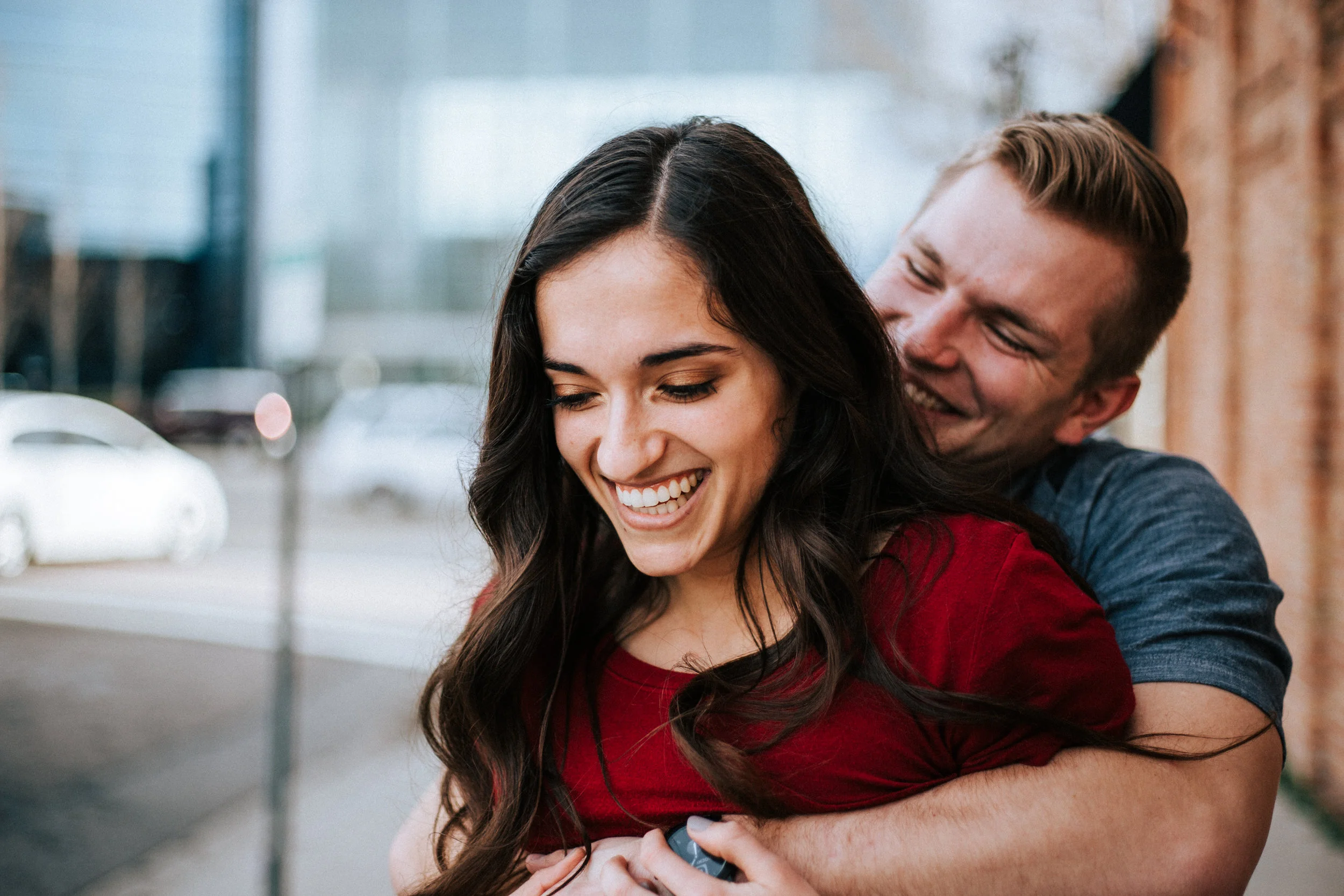 Downtown city couple laughing portraits Utah