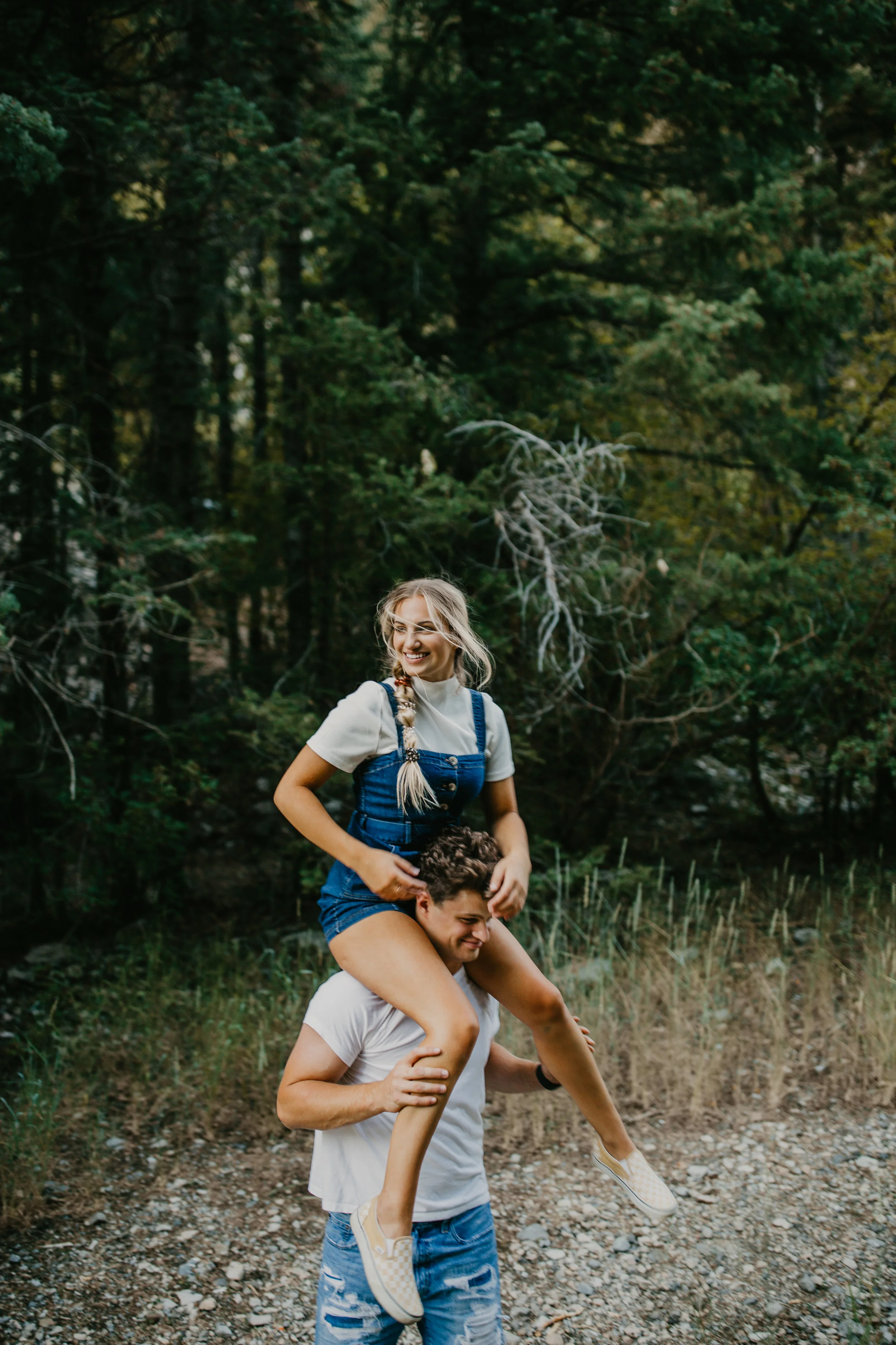 Girl on shoulders forest engagements in Utah mountains