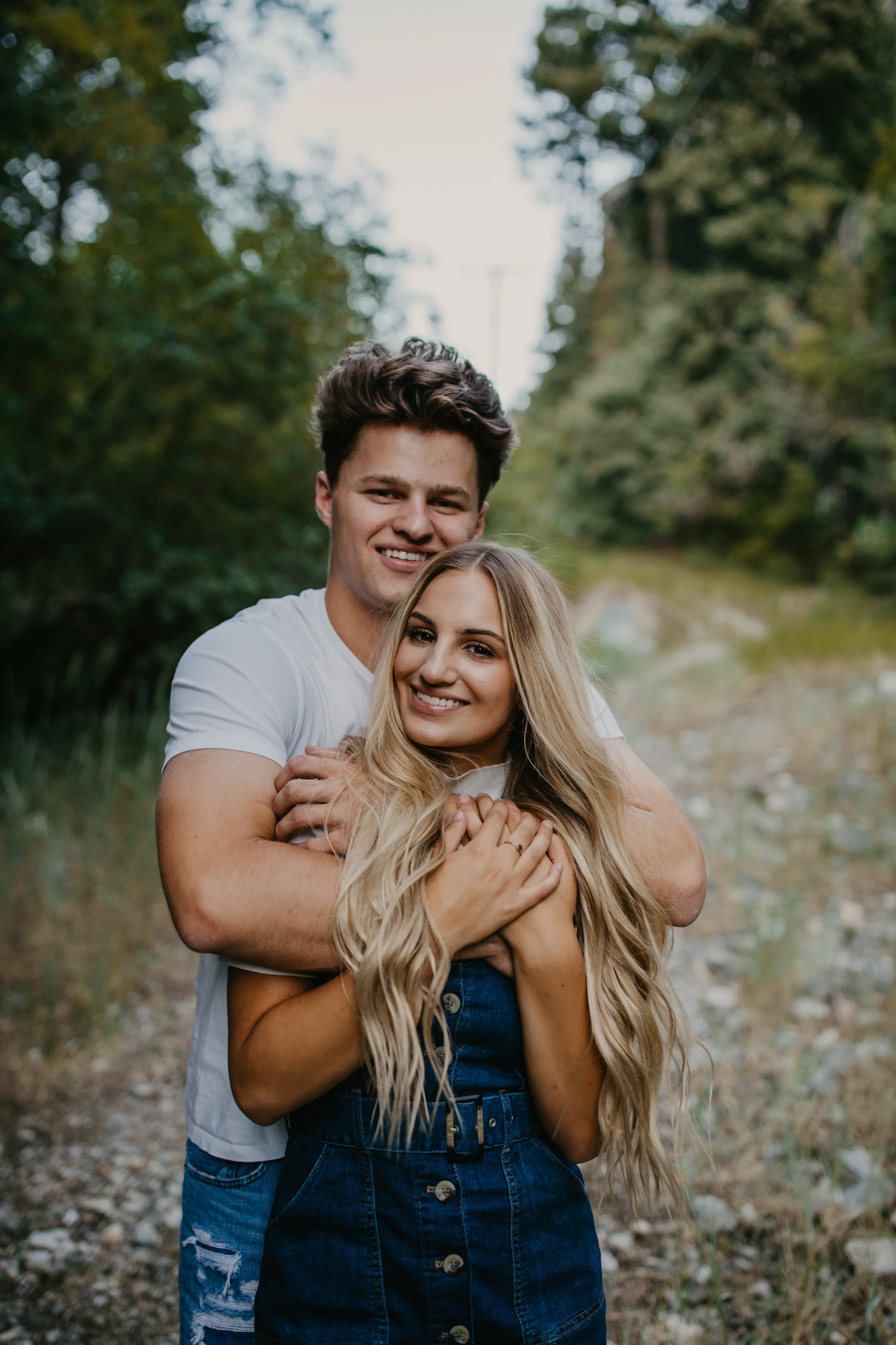 Romantic forest engagement session in Utah mountains long blonde hair