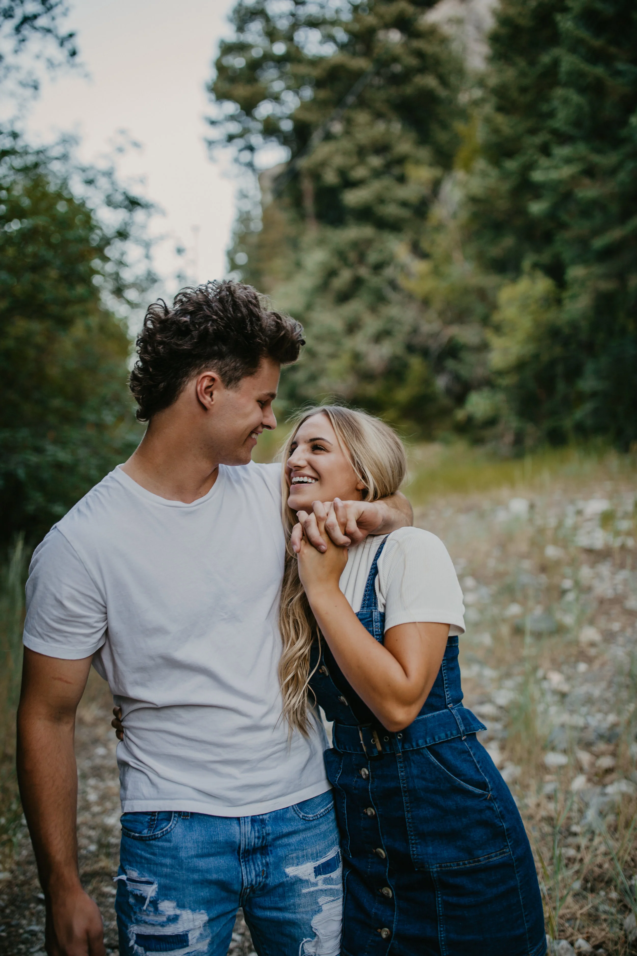 Romantic forest engagement session in Utah mountains long blonde hair