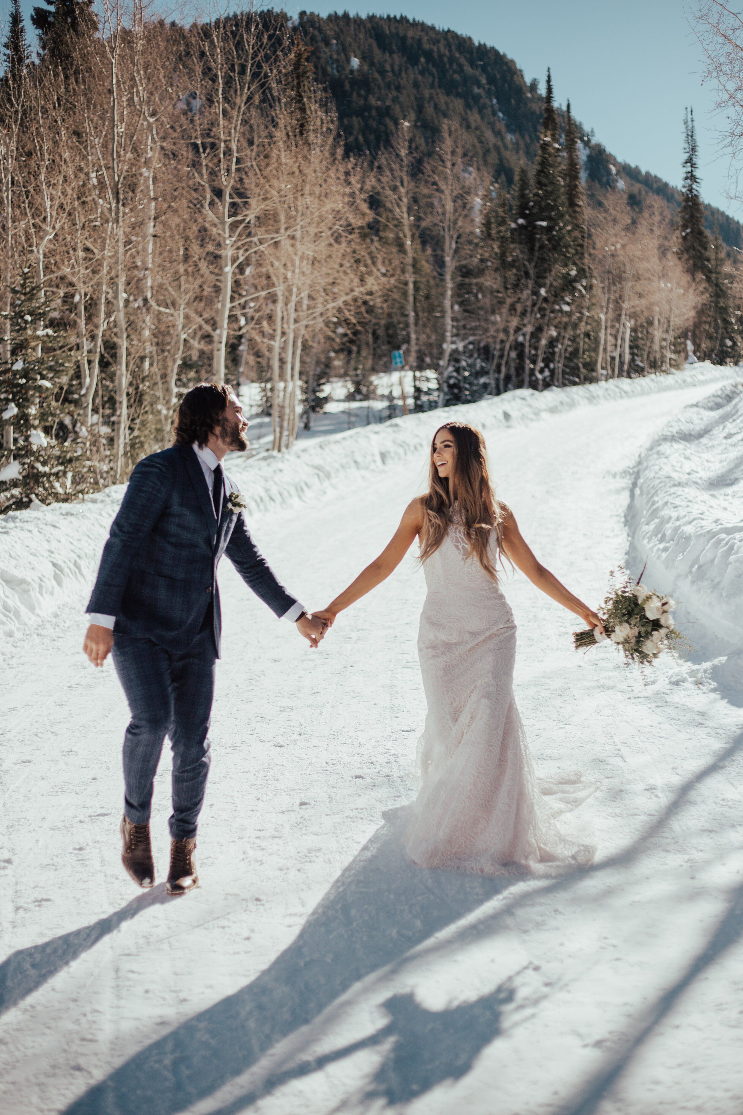 Winter mountain snowy bridals formal session bride groom sun flare pine trees wedding photos dress beard #bridals #weddingphotos #brideandgroom #utahphotographer #weddingphotographer #winterwedding
