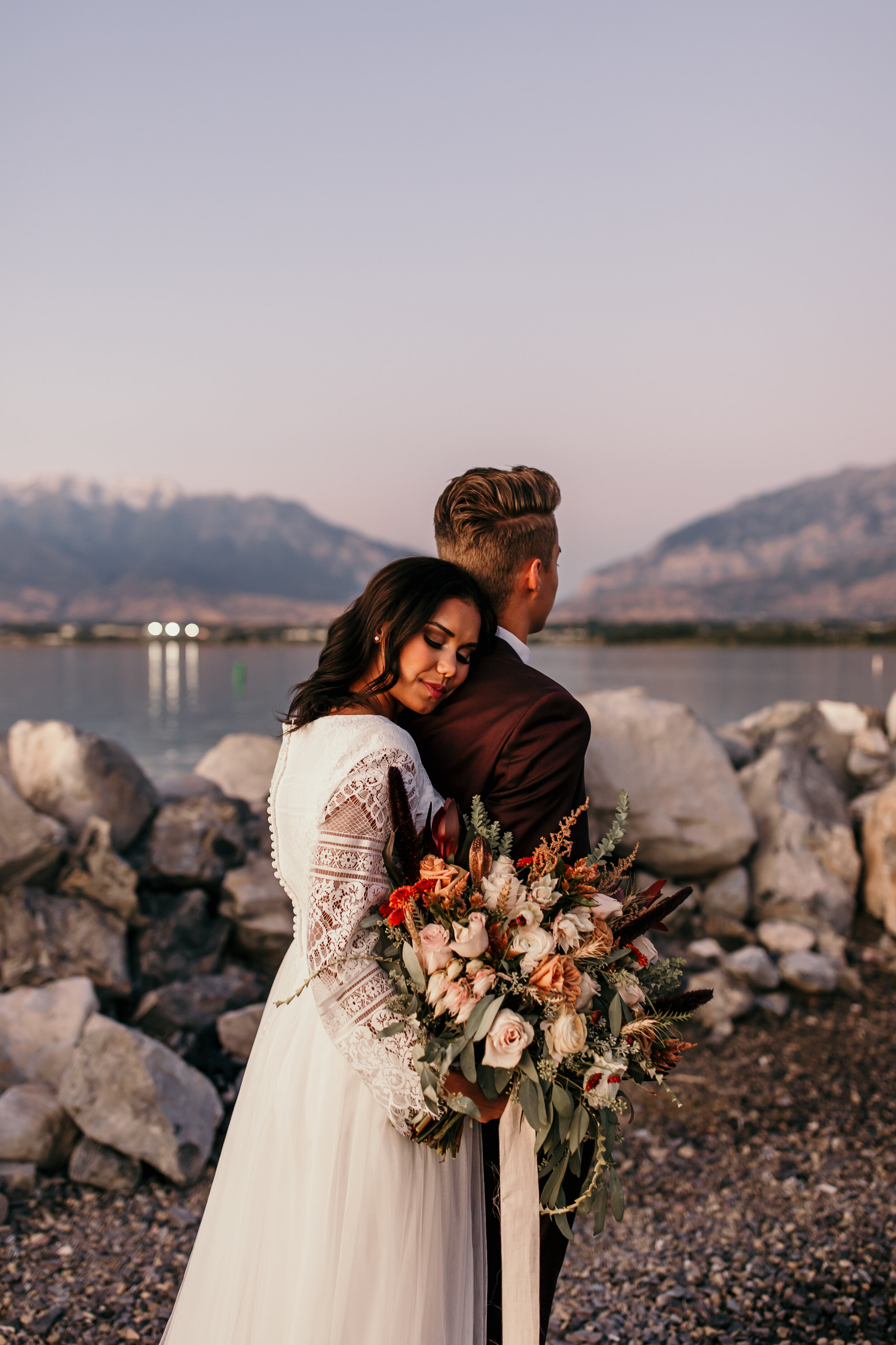 Sunset bridals bouquet wedding dress bride and groom lake ocean beach Utah lake marina #utahphotographer #weddingphotographer #bride #bridals #brideandgroom #weddingphotos