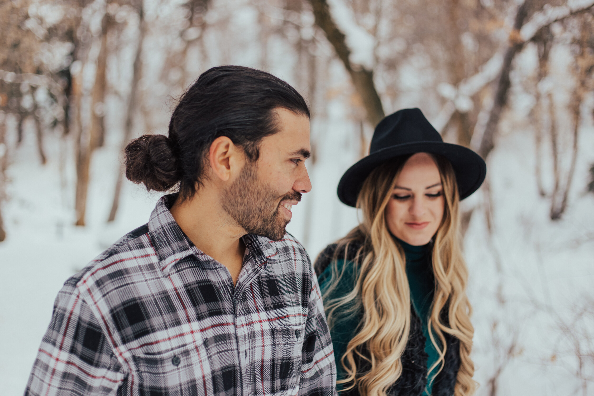 Snowy winter mountain couple anniversary shoot engagement session romantic playful happy #utahphotographer #weddingphotographer #engagements #coupleshoot #engagementsession