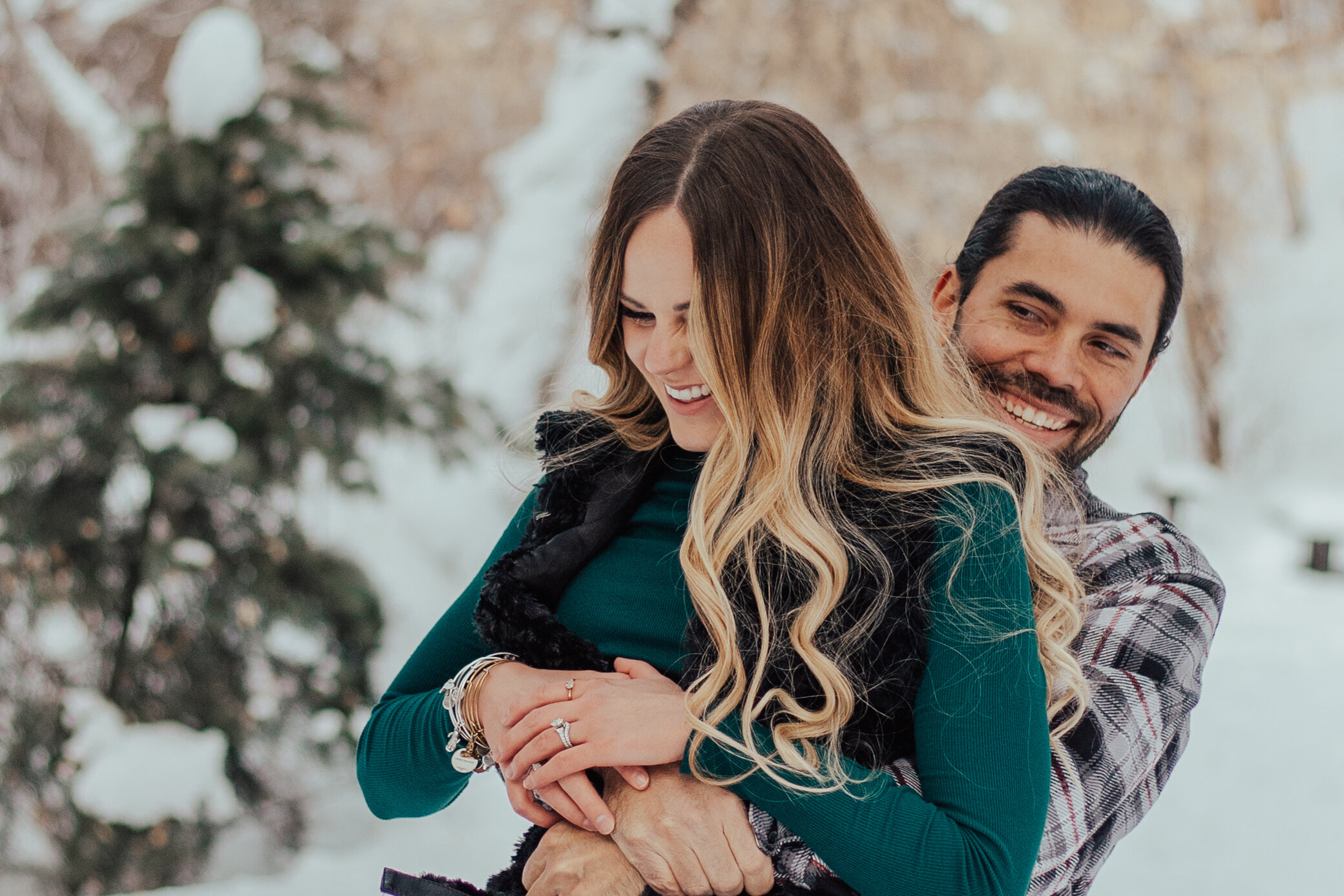 Snowy winter mountain couple anniversary shoot engagement session romantic playful happy #utahphotographer #weddingphotographer #engagements #coupleshoot #engagementsession
