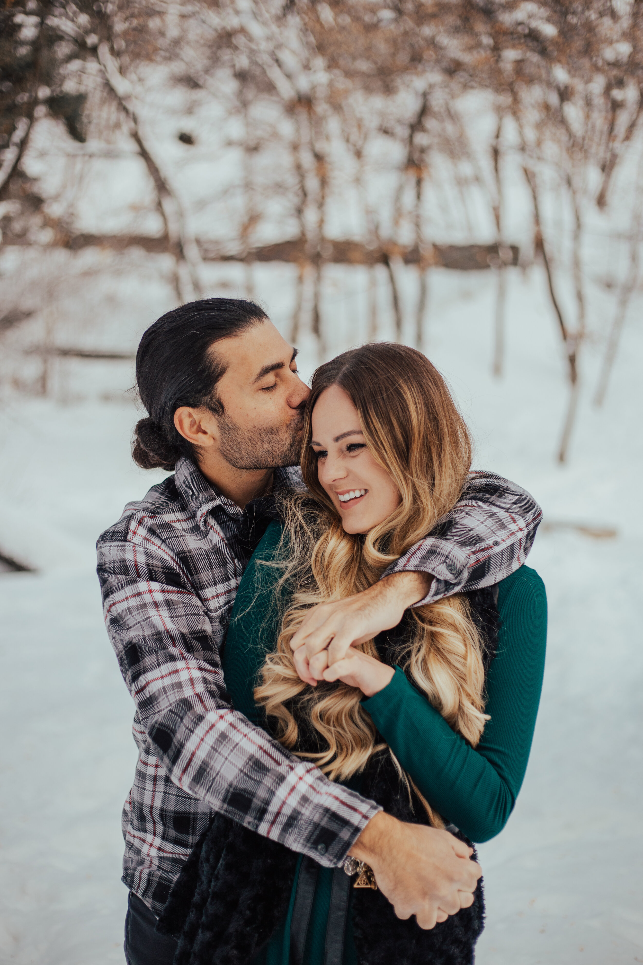 Snowy winter mountain couple anniversary shoot engagement session romantic playful happy #utahphotographer #weddingphotographer #engagements #coupleshoot #engagementsession