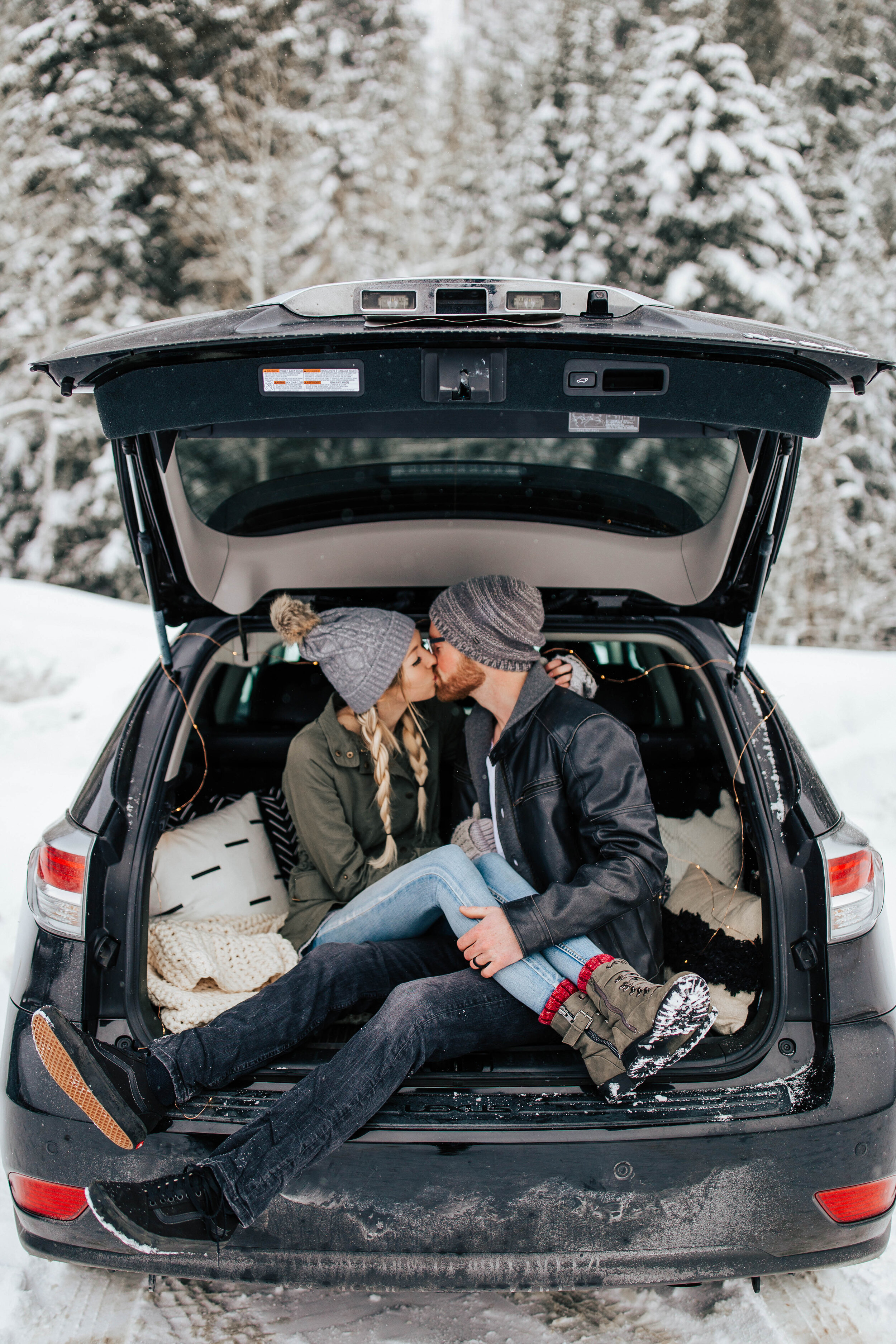 Cozy winter couple shoot beanies coats blankets snuggling snowy mountains pine trees adventurous #utahphotographer #coupleshoot #engagementsession #engagementshoot #weddingphotographer