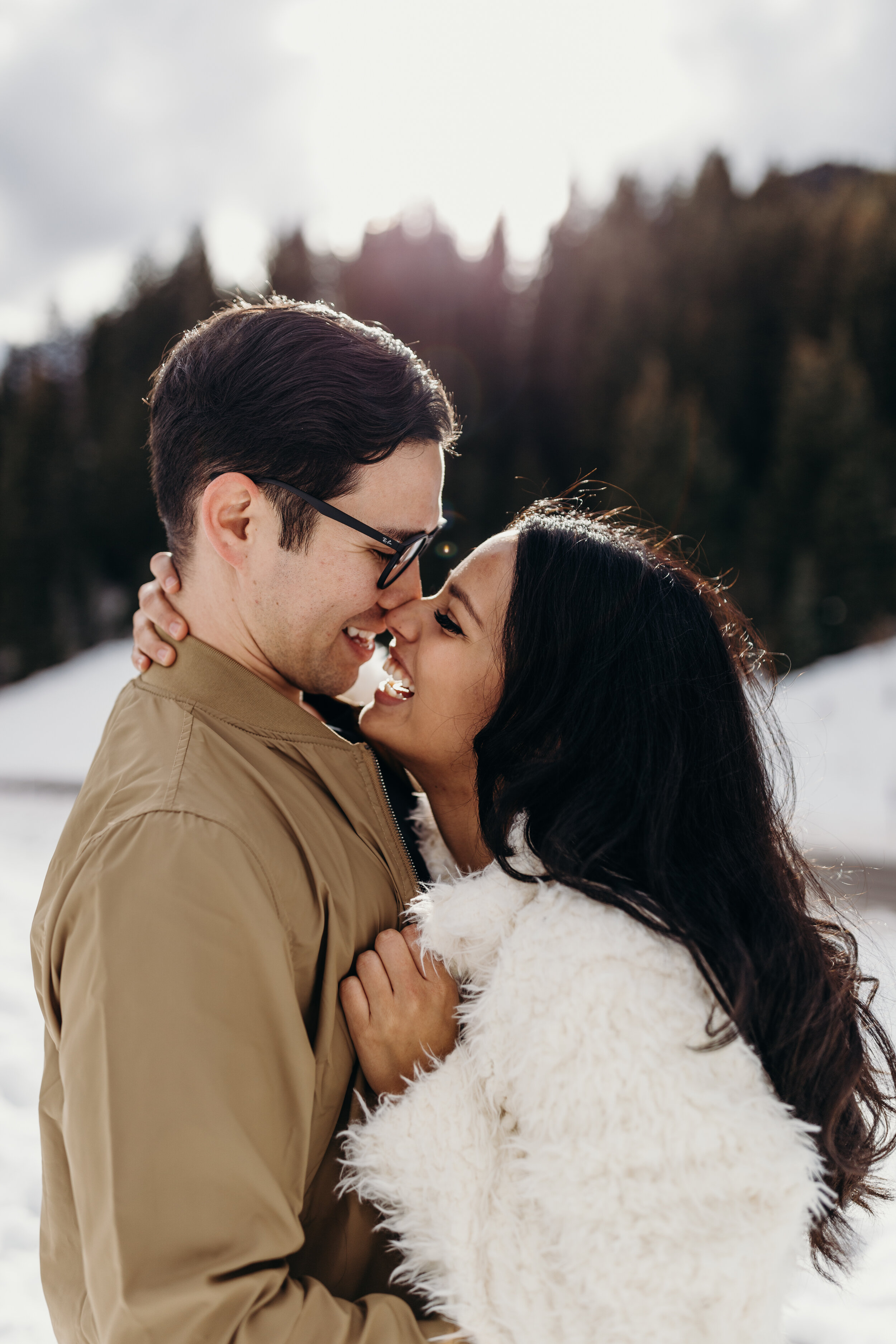 Cozy winter couple shoot snowy mountains engagement session photoshoot #coupleshoot #engagements #engagementshoot #weddingphotographer #utahphotographer sun flare