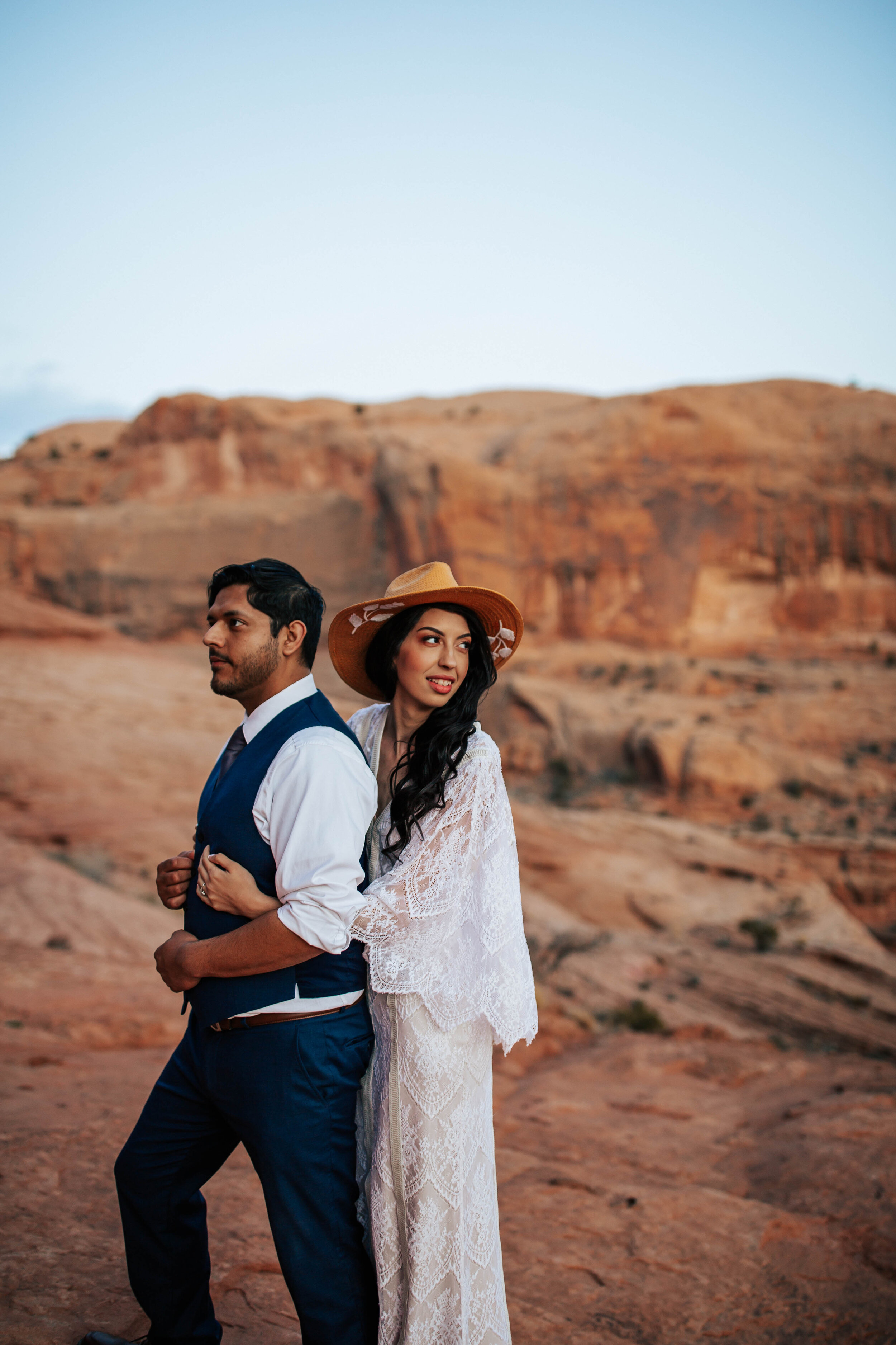 Moab Utah elopement bridal shoot bride and groom Arches national park boho wedding dress #moabphotographer #moabelopement #elopementphotographer #weddingphotographer