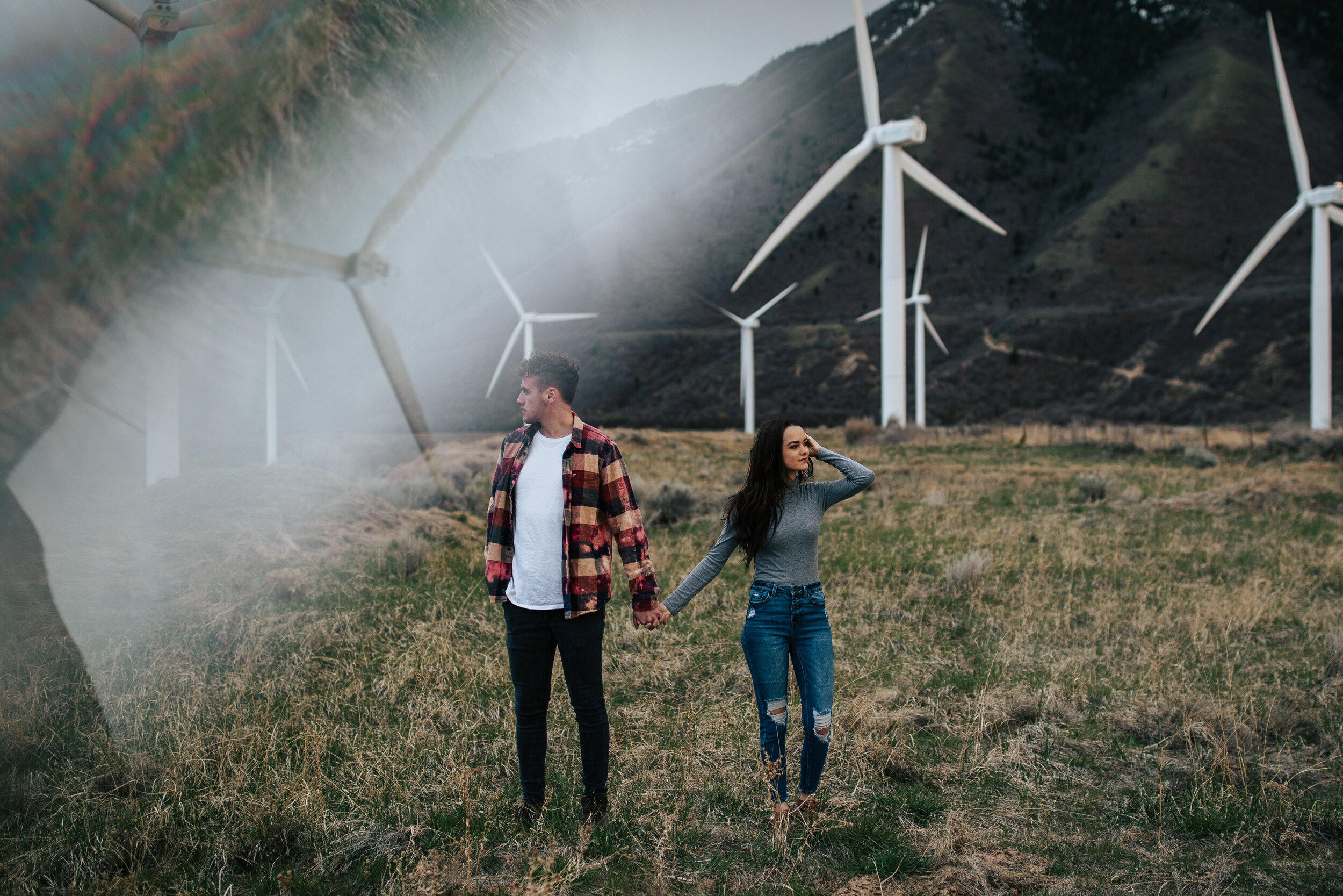 Overcast windy adventurous couples session windmills moody evening shoot. Engagement session. Utah wedding photographer. #utahphotographer #oregonphotographer #washingtonphotographer #coupleshoot